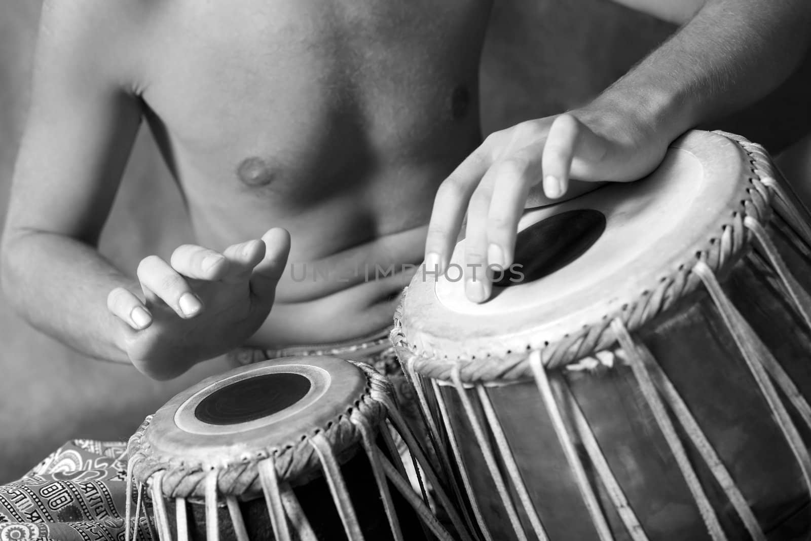 Man playing the nigerian drum in studio