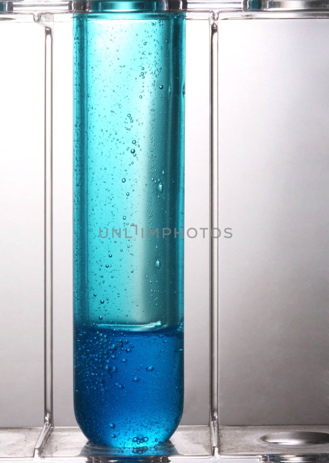Test tube with a dark blue liquid on a white background