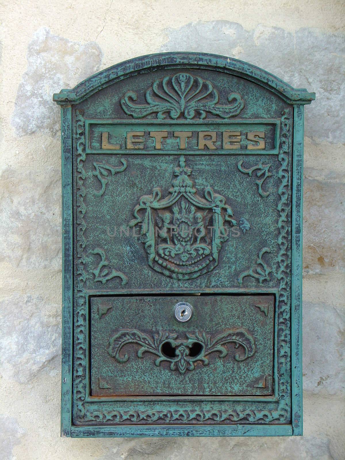 Old-fashioned French mailbox on the old wall