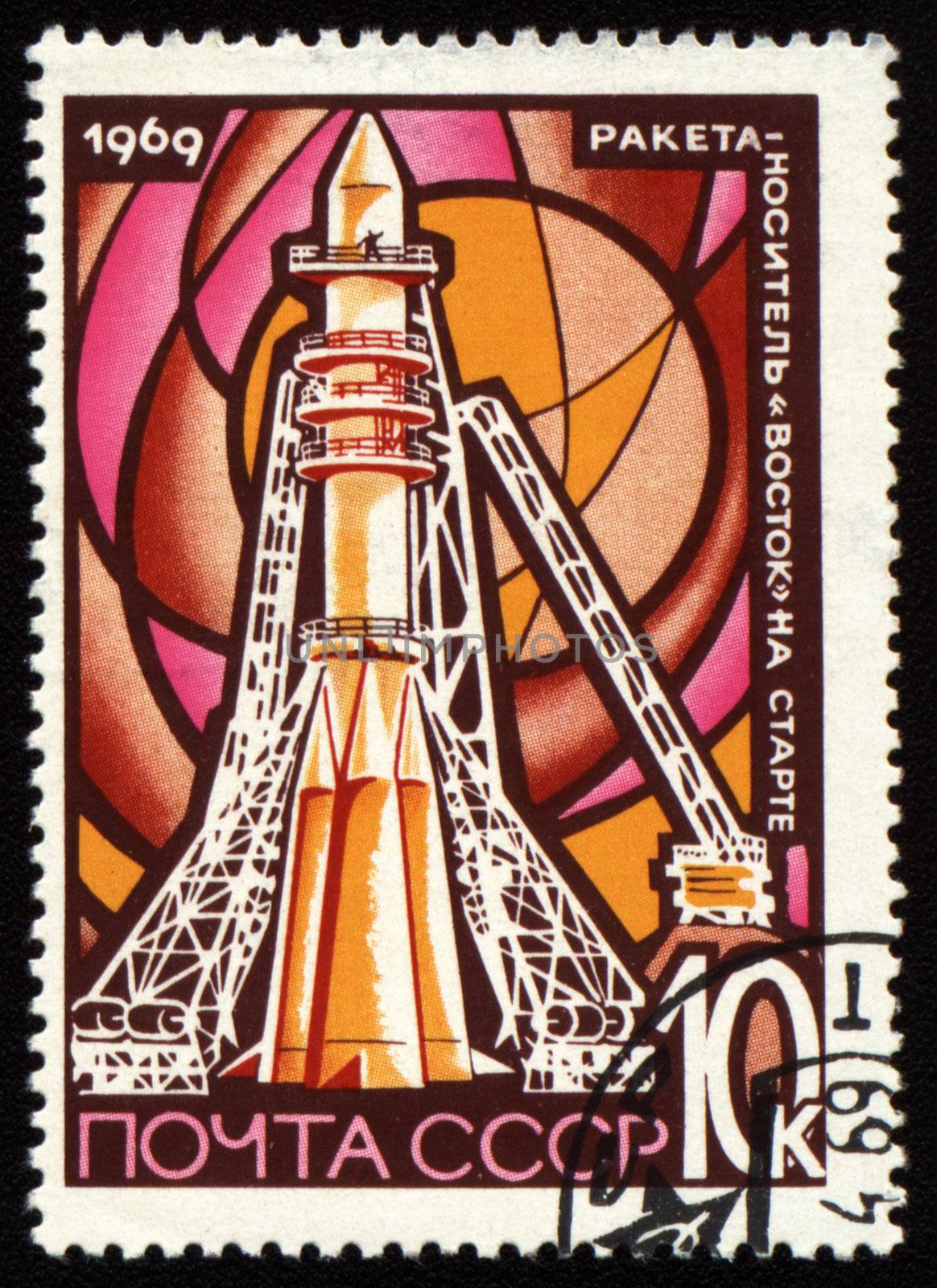 Postage stamp printed in USSR shows space rocket Vostok on launch pad Baikonur, circa 1969