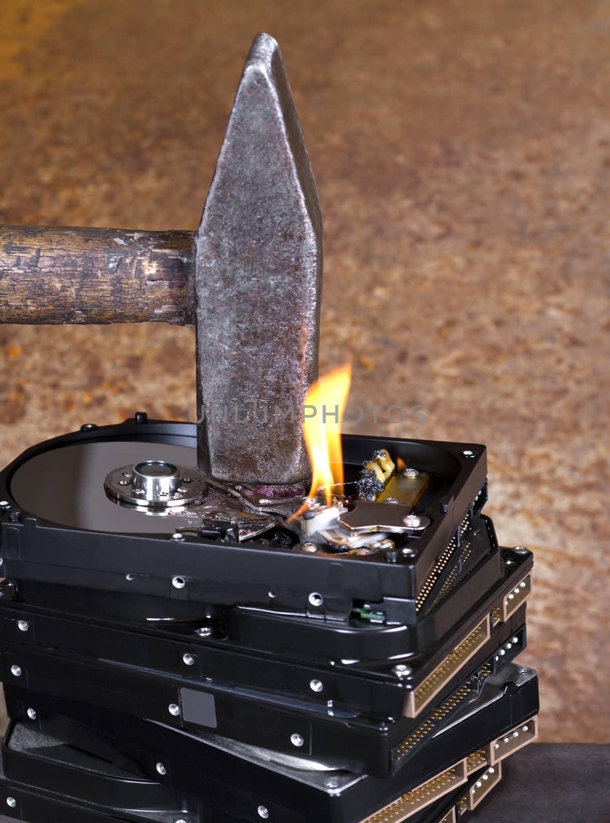 hammer on stack of hard disk by gewoldi