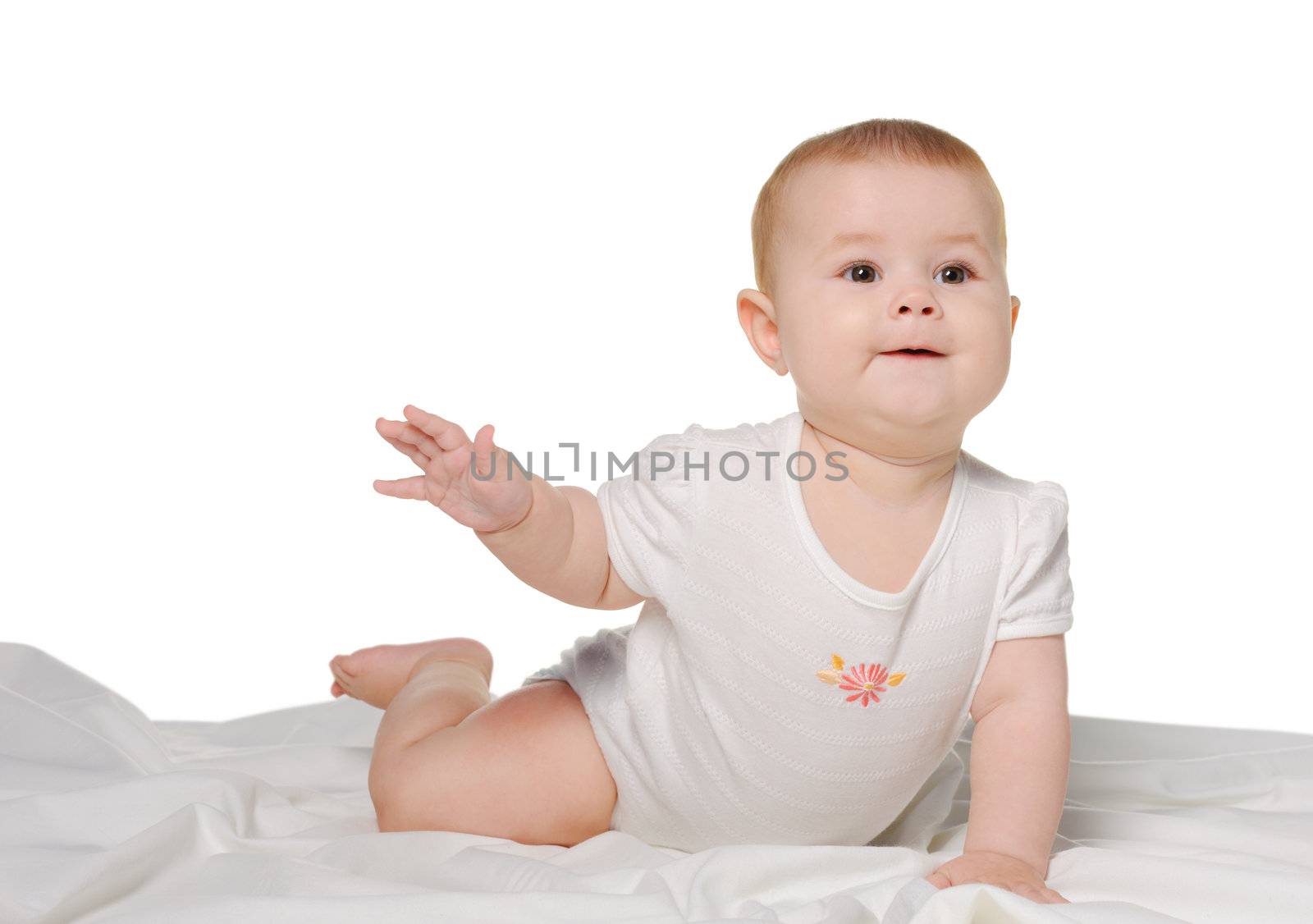 The baby on a bedsheet. Age of 8 months. It is isolated on a white background