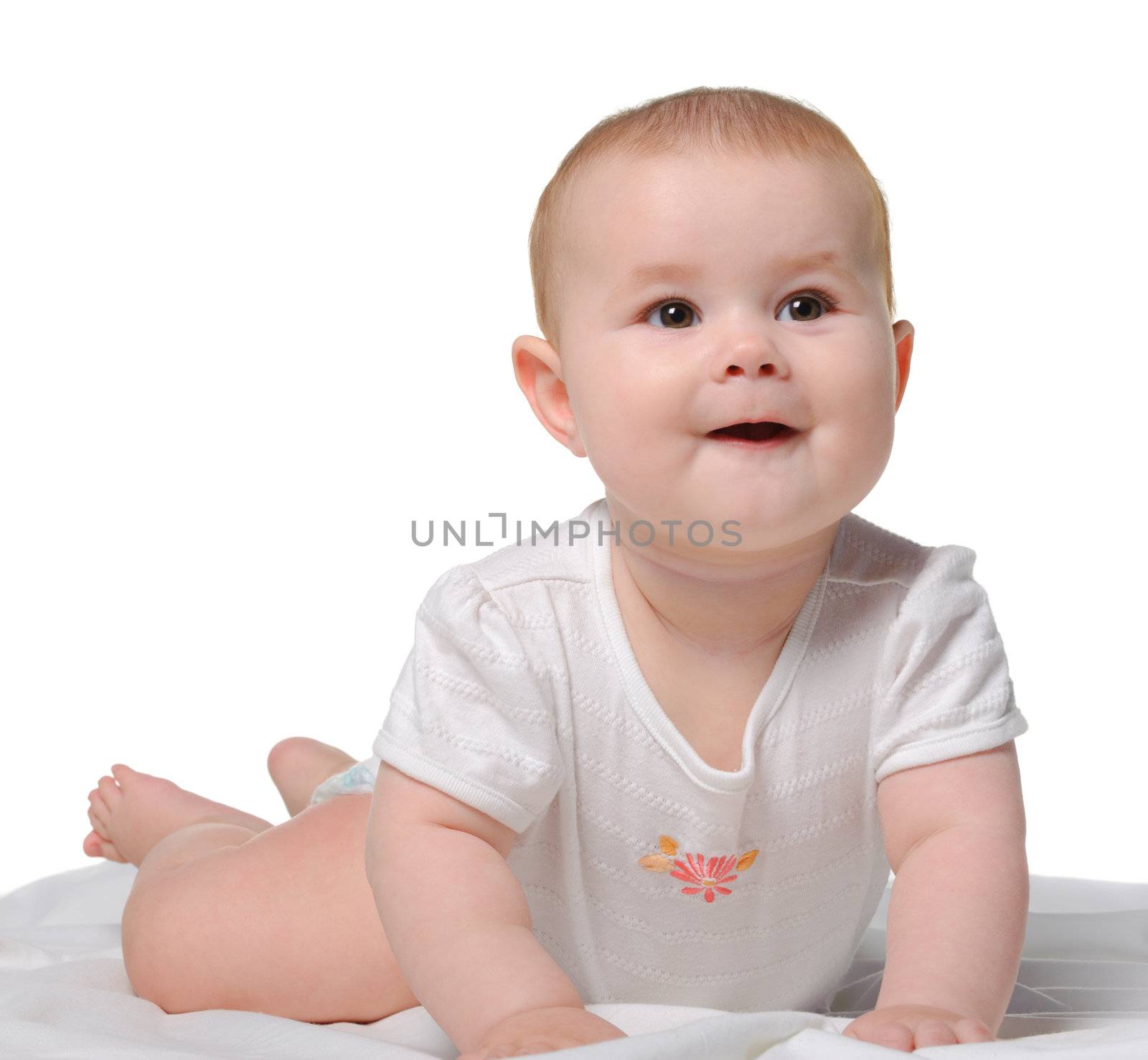 The baby on a bedsheet. Age of 8 months. It is isolated on a white background