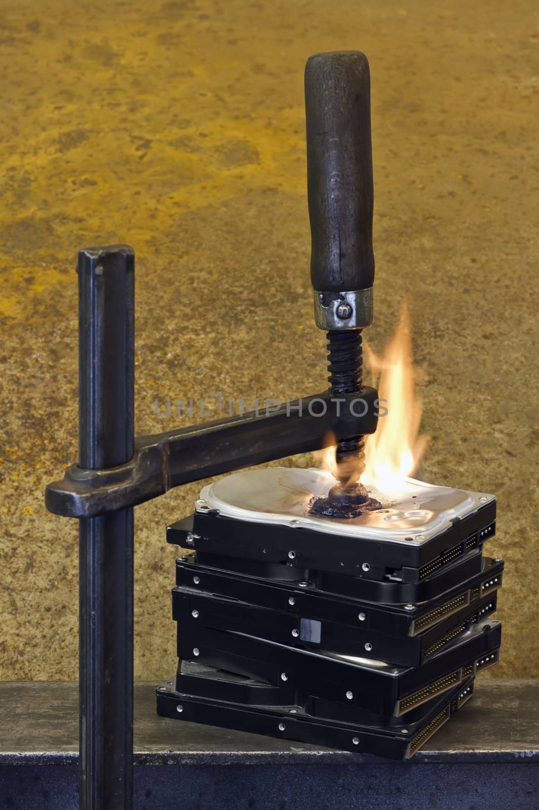 burning stack of hard drive pressed together with clamp by gewoldi