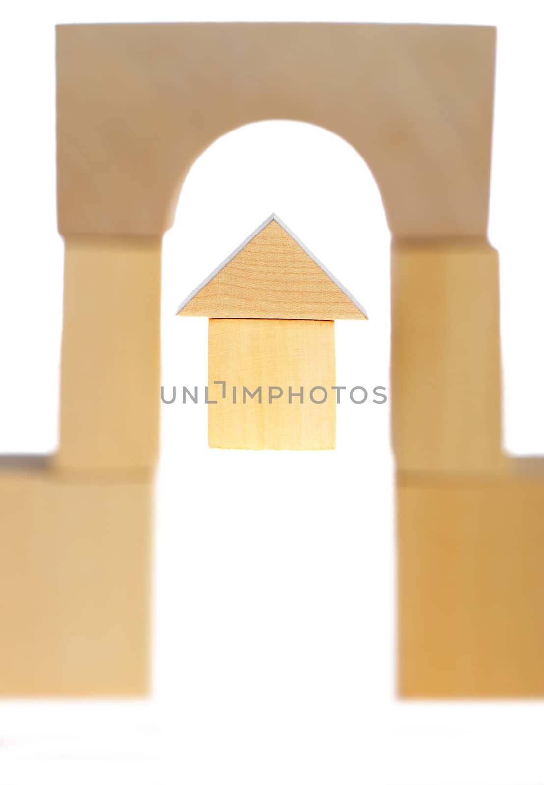 The wooden house. Children's toys - wooden cubes. It is isolated on a white background