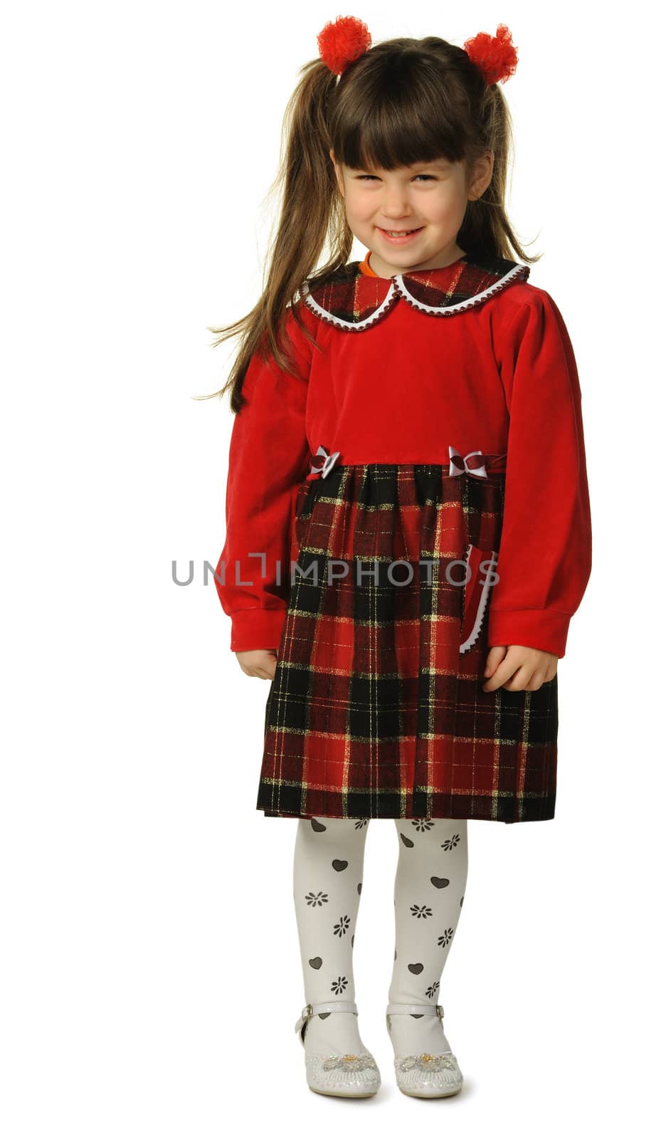 Portrait of the pretty little girl in full growth. It is isolated on a white background