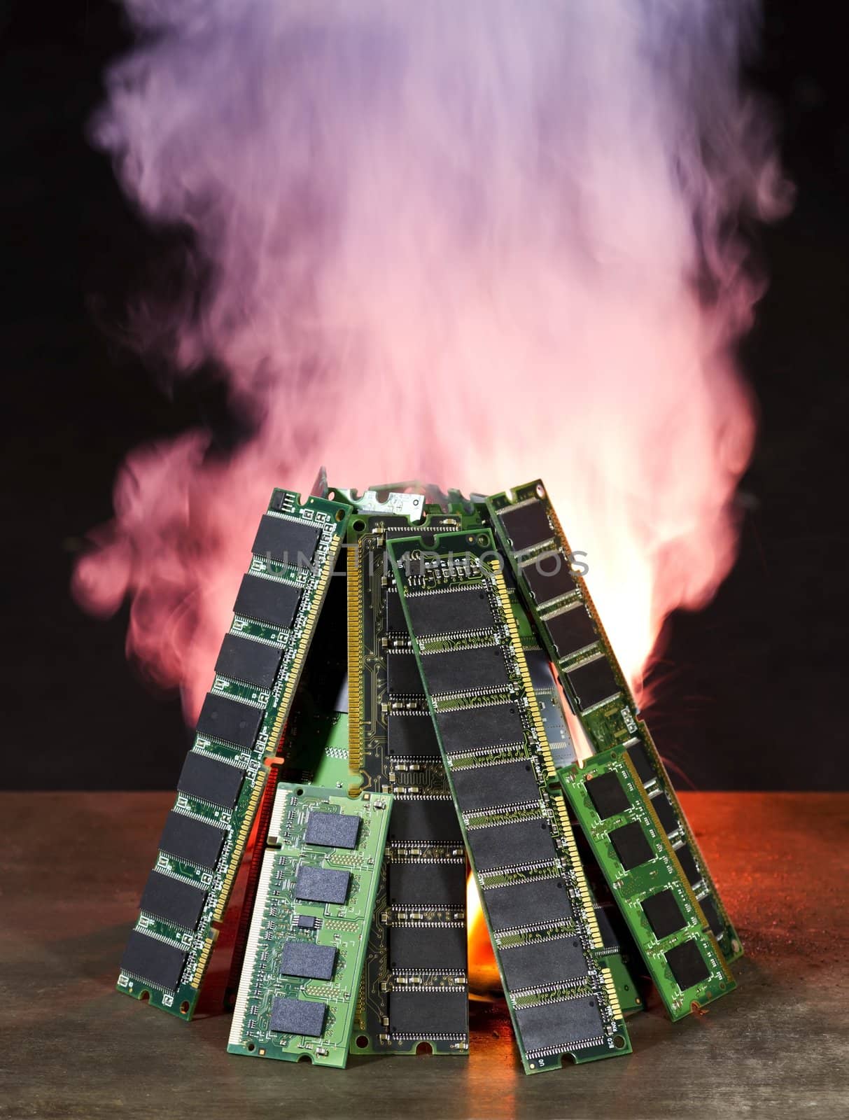 burning computer memory modules with flames and smoke in black background