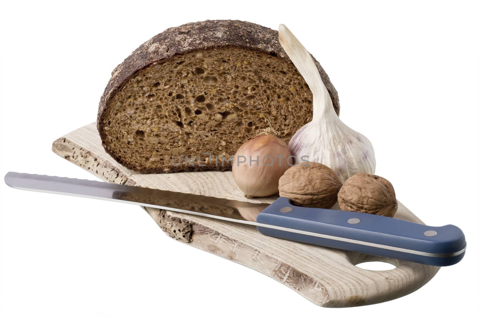 brown bread on shelf with onion, garlic and walnut  isolated on white background