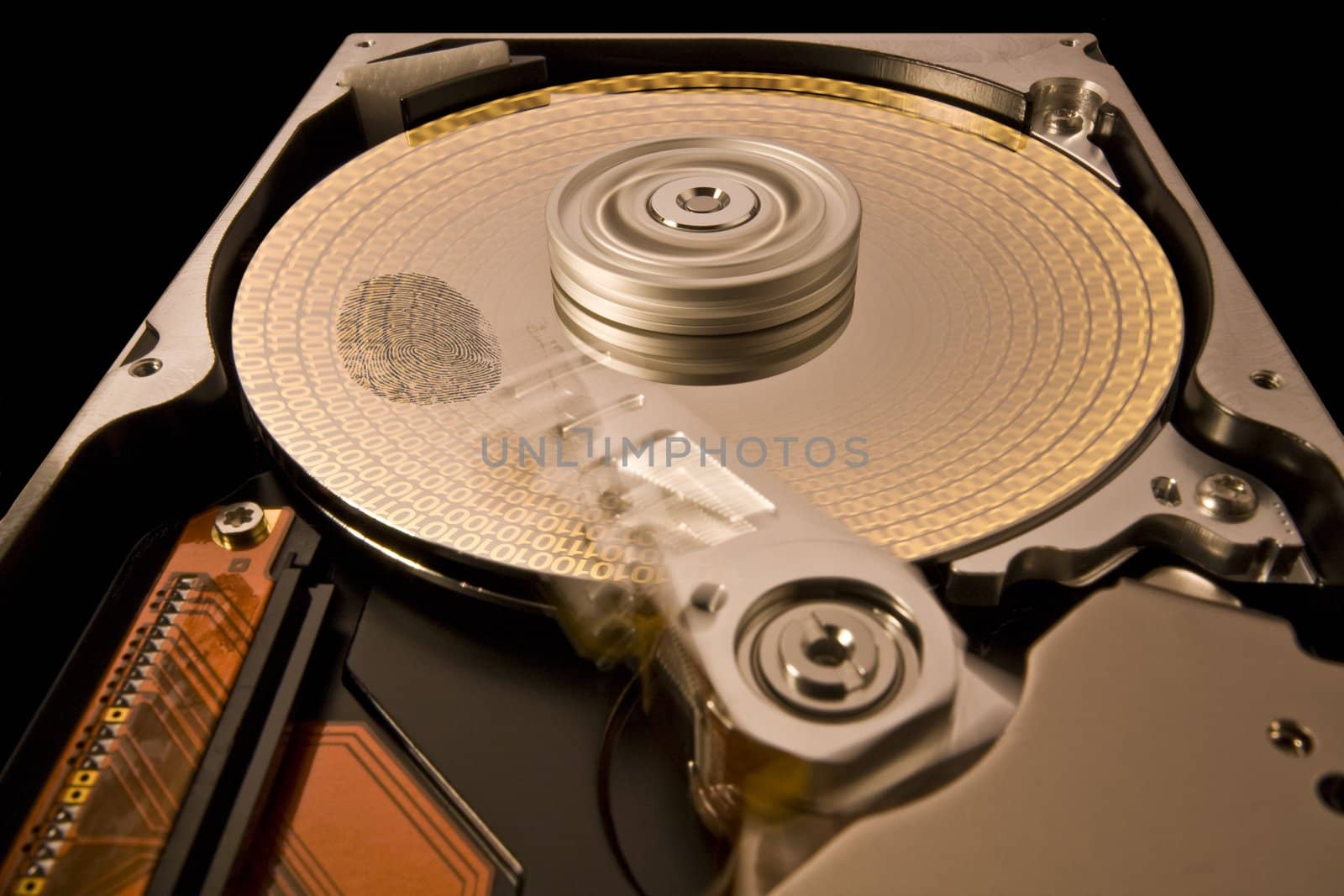 rotating hard disk with data and fingerprint. Read write head is n�n motion. black background