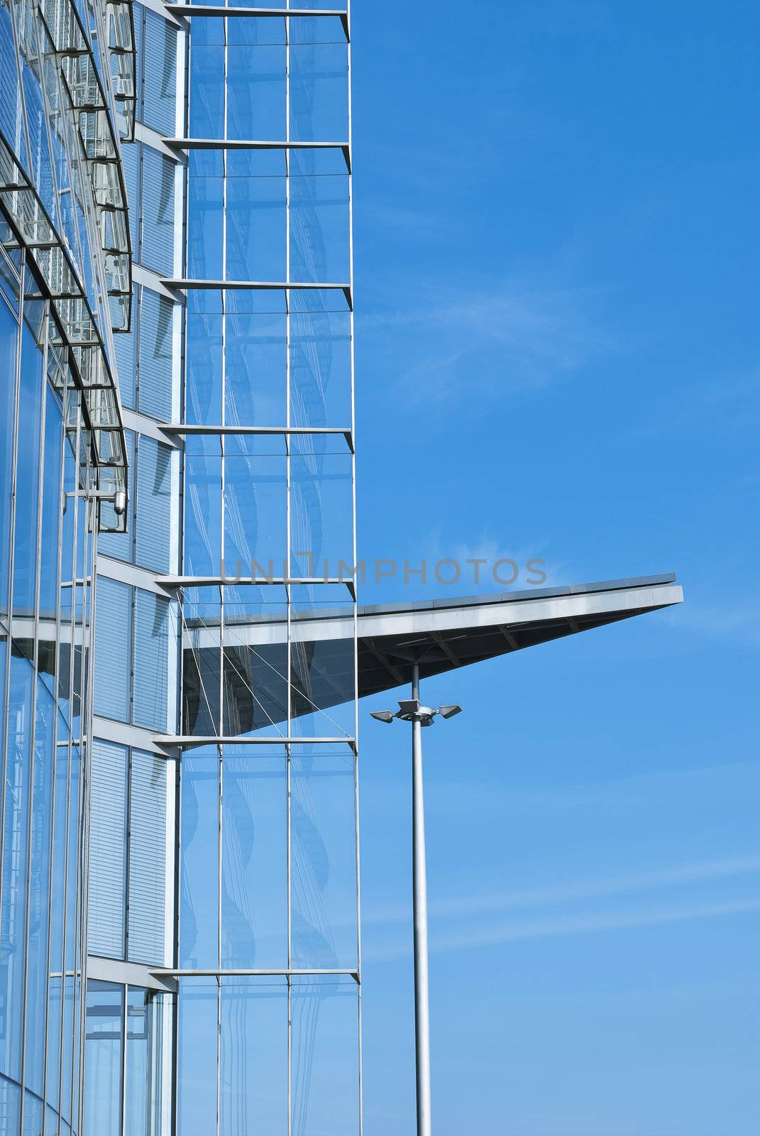 Modern building of glass and metal on blue sky background in Germany