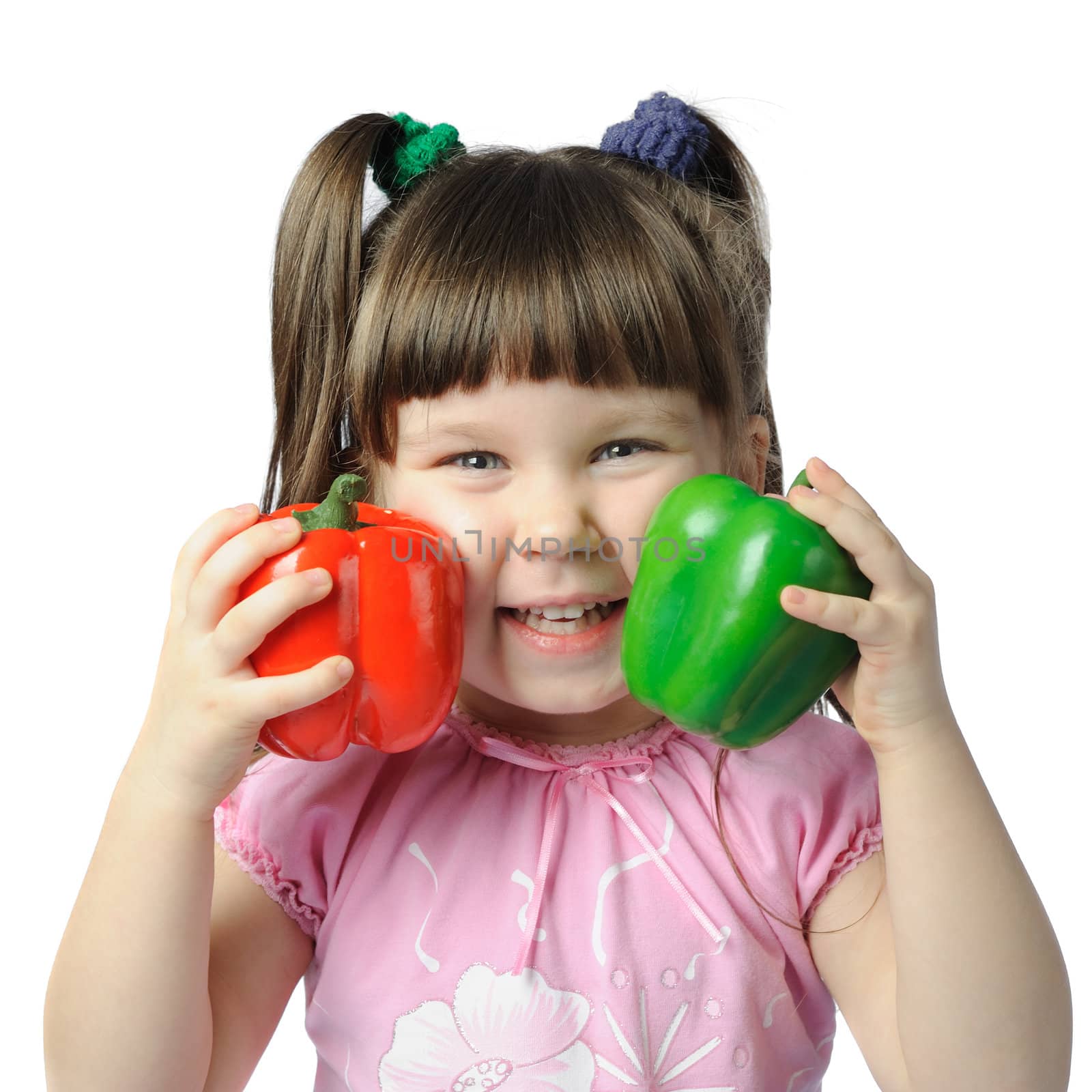 The little girl with color pepper. It is isolated on a white background