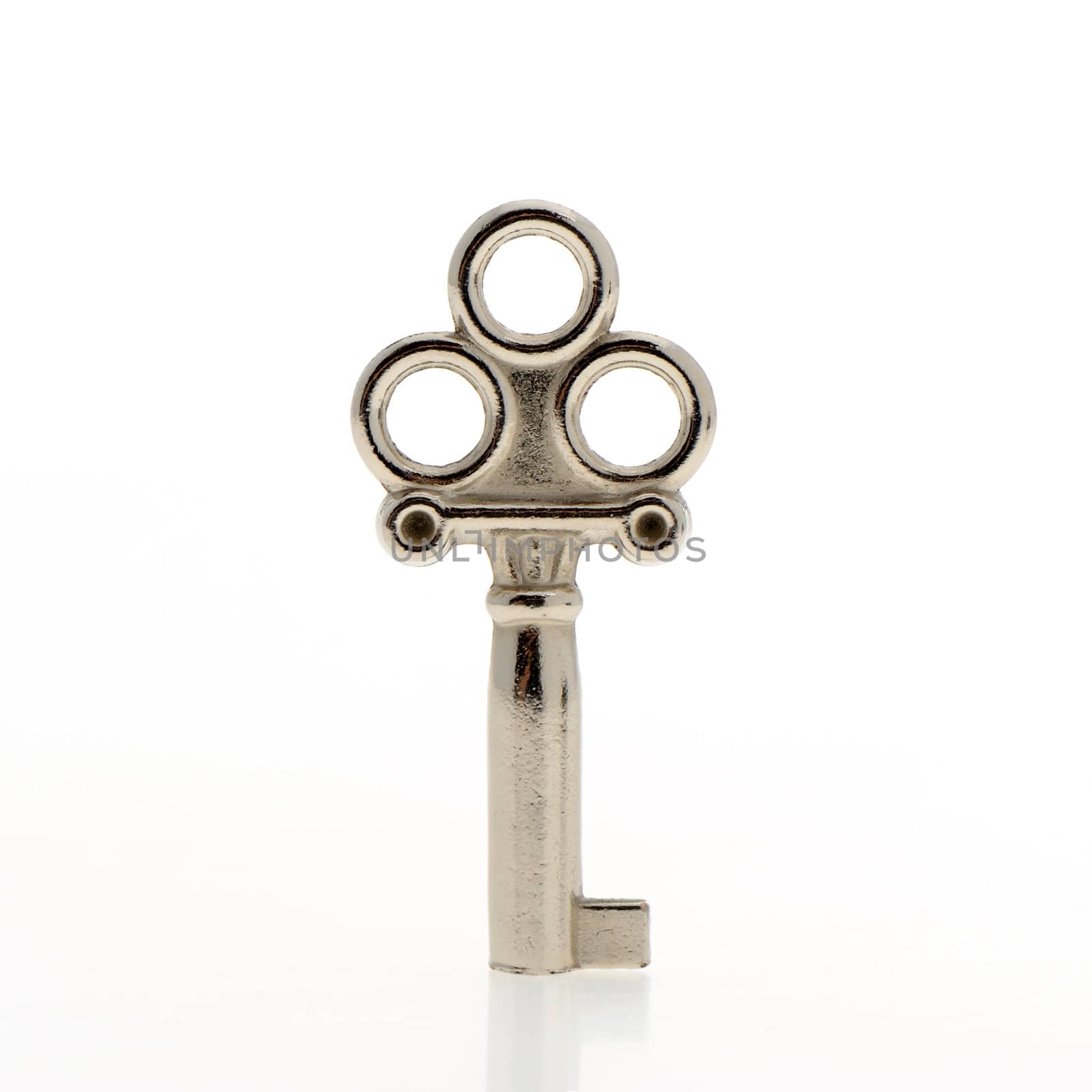 Decorative key. An iron key from the lock isolated on a white background