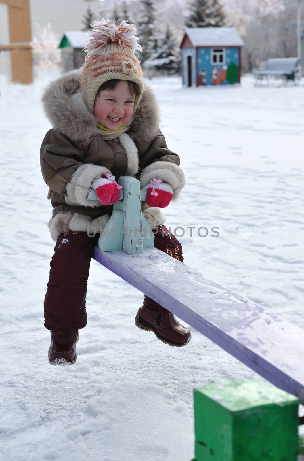 The girl on a swing. Winter, solar frosty weather