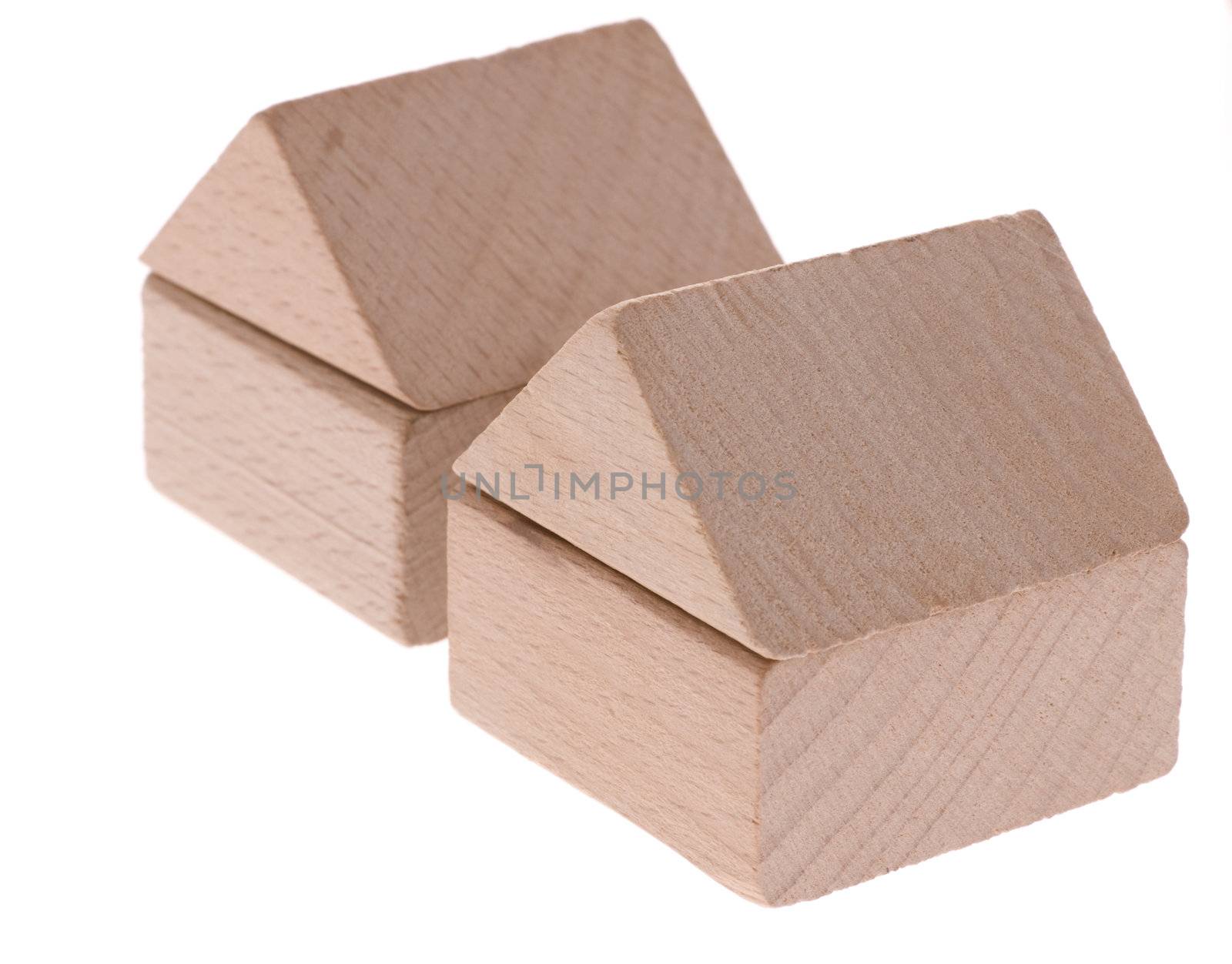 Toy houses. Wooden cubes combined in the form of constructions