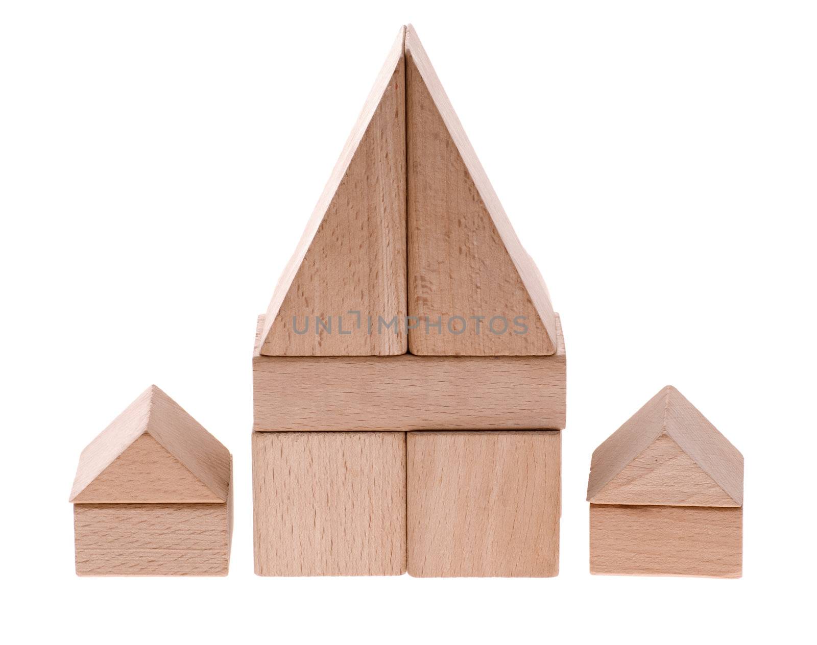 Toy houses. Wooden cubes combined in the form of constructions