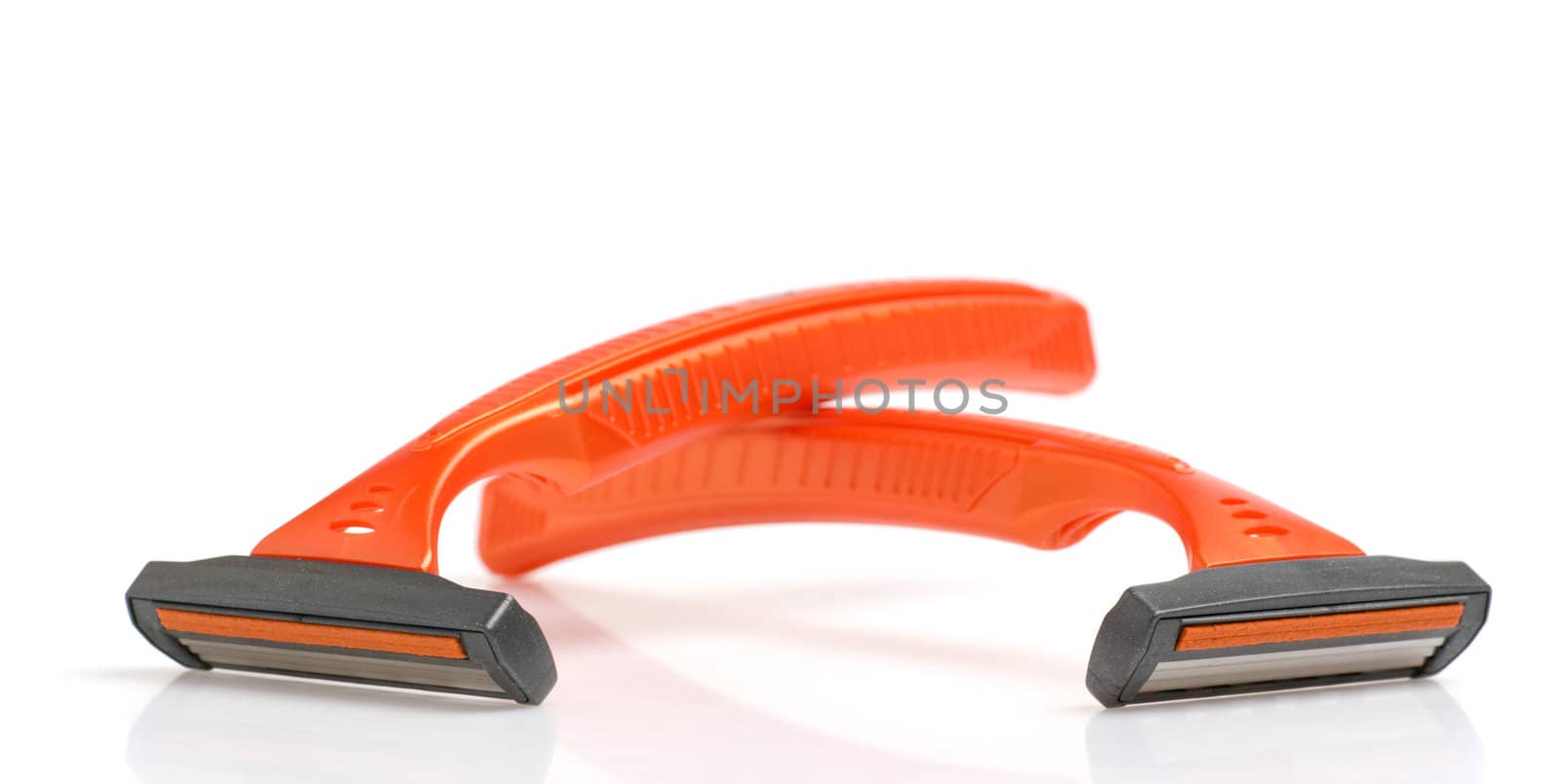 The disposable razor. The shaving machine tool isolated on a white background
