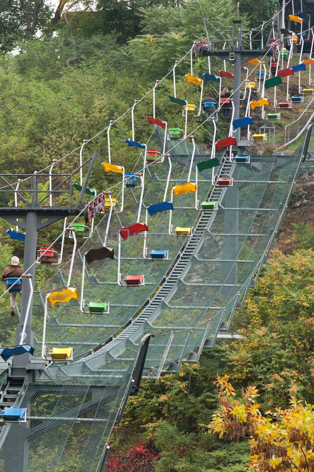 Funicular railway with varicoloured easy chair in zoo of the Prague
