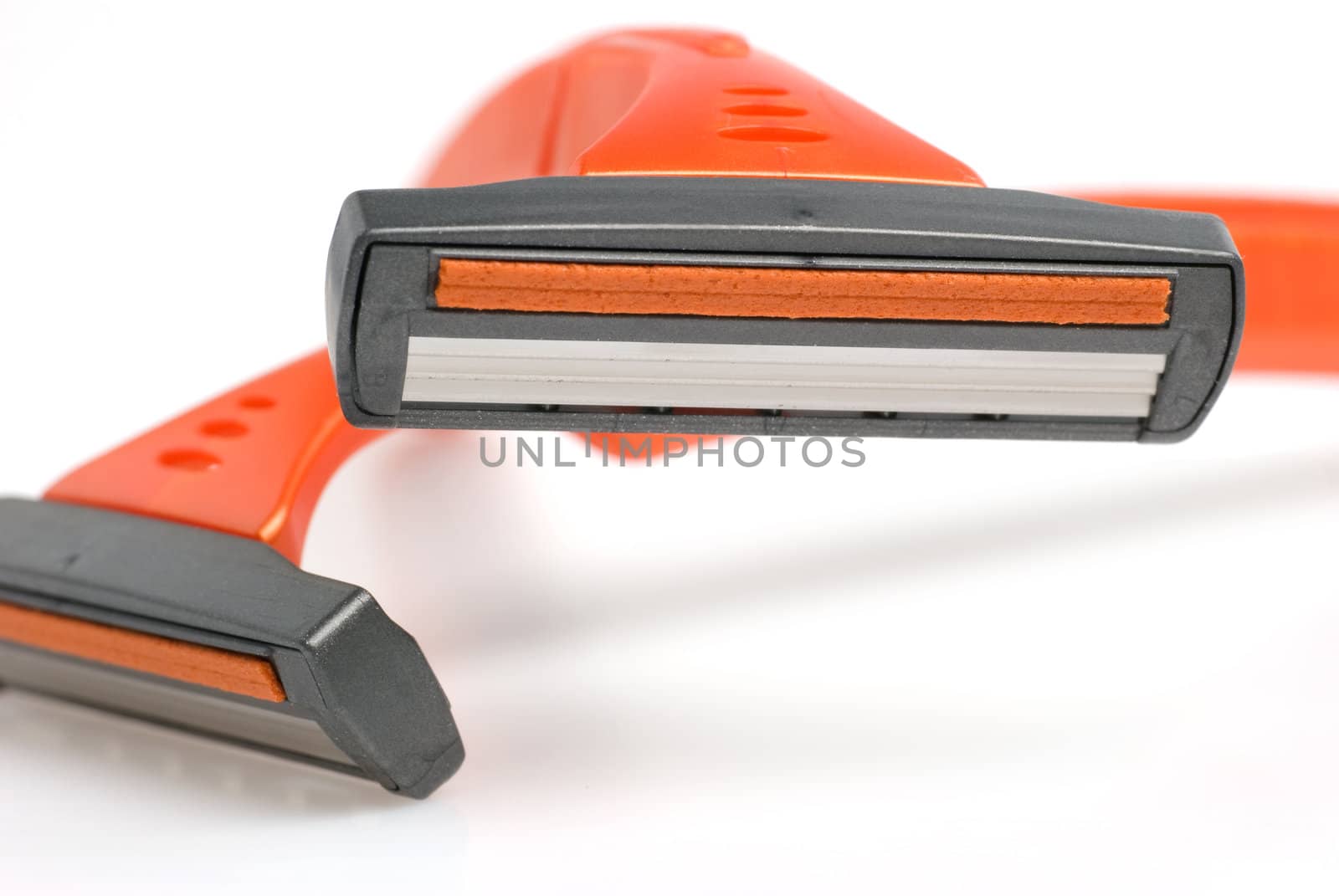 The disposable razor. The shaving machine tool isolated on a white background