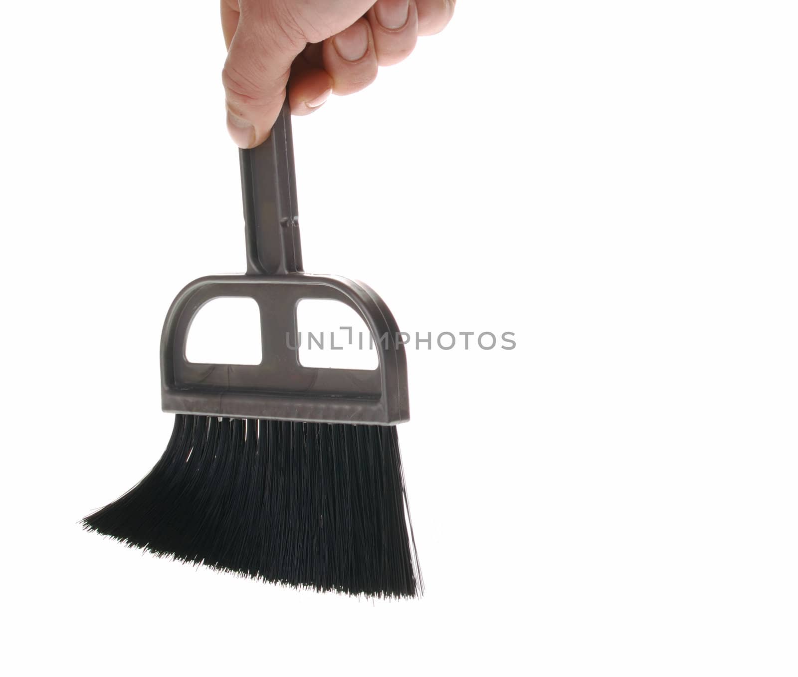 Brush in man hand. The tool for cleaning it is isolated on a white background