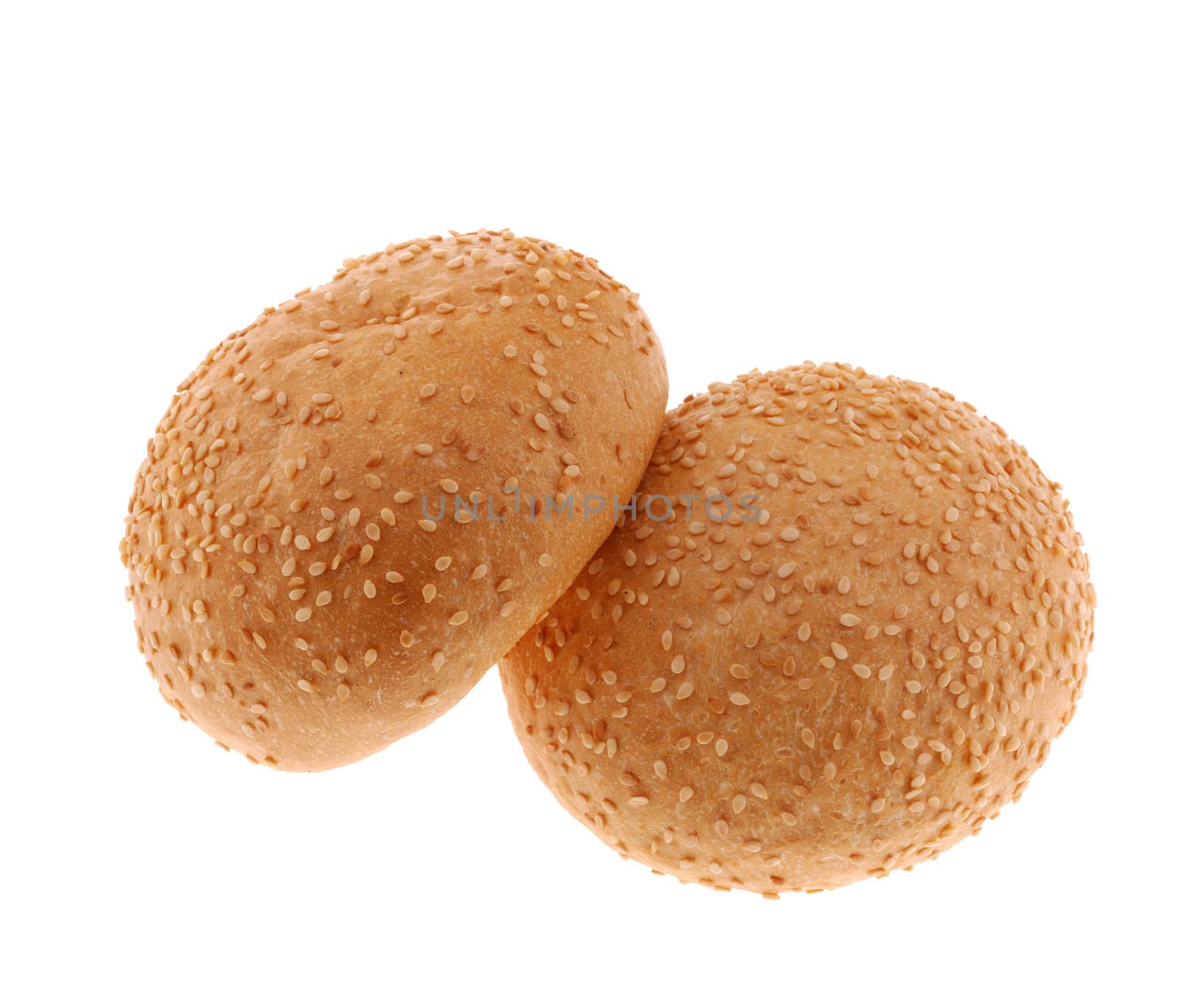 bun for sandwich. A bakery product strewed by grains