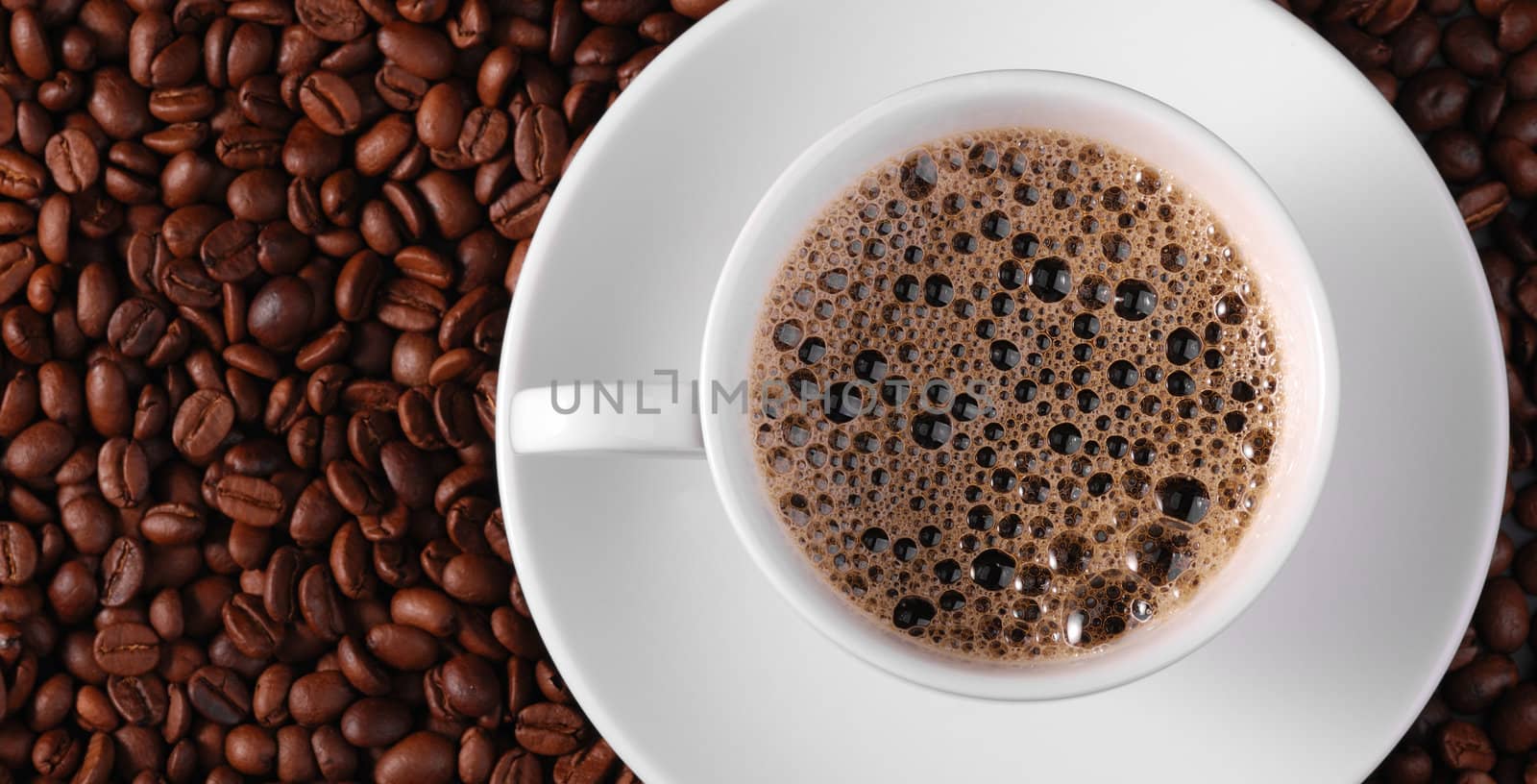 Cup of coffee. A background with coffee grains and a white cup. A photo close up 