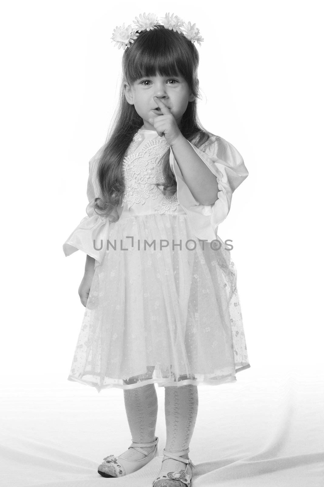 The girl in a white dress. It is isolated on a white background. Age 3 years