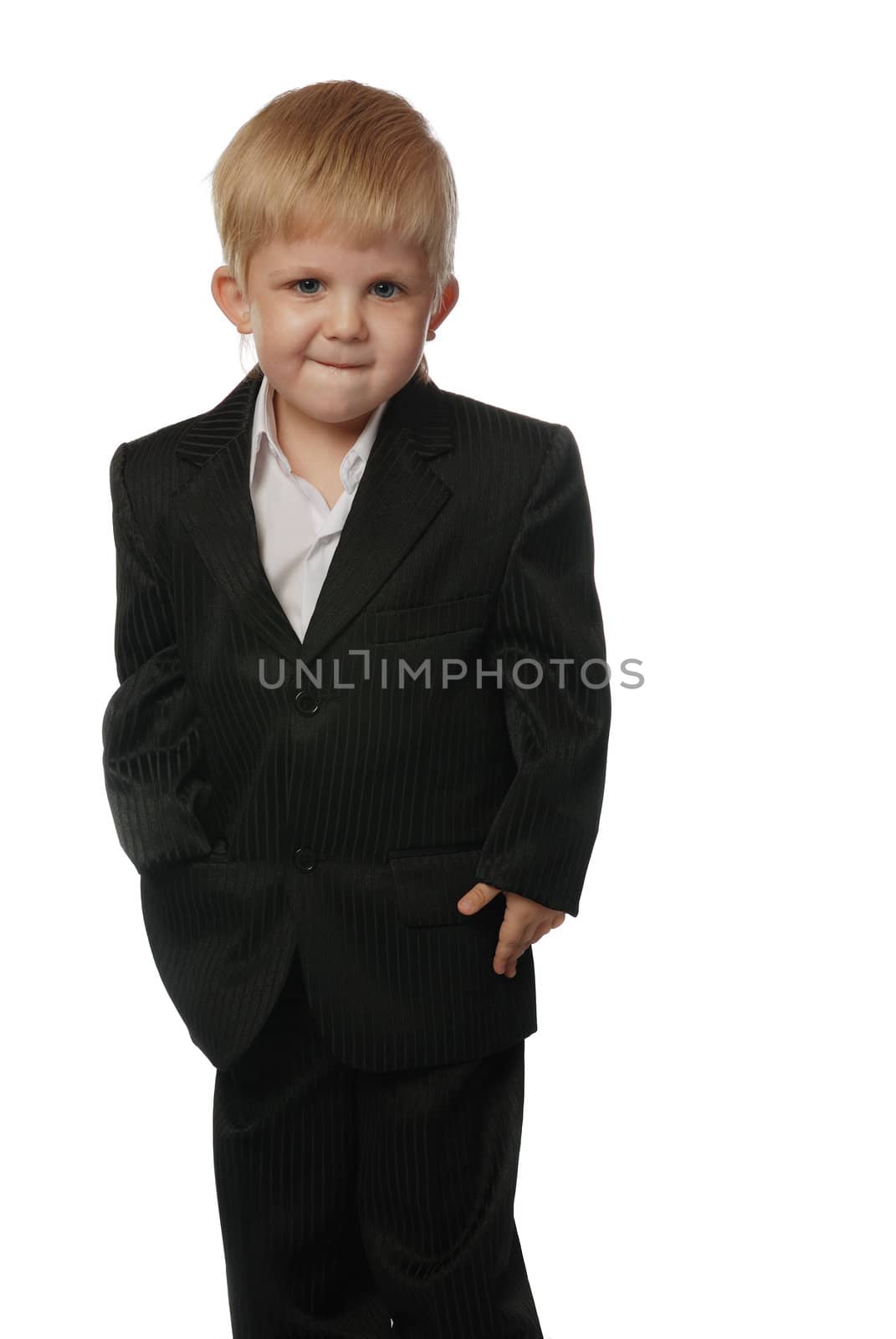 The boy in a suit. It is isolated on a white background. Age 3 years