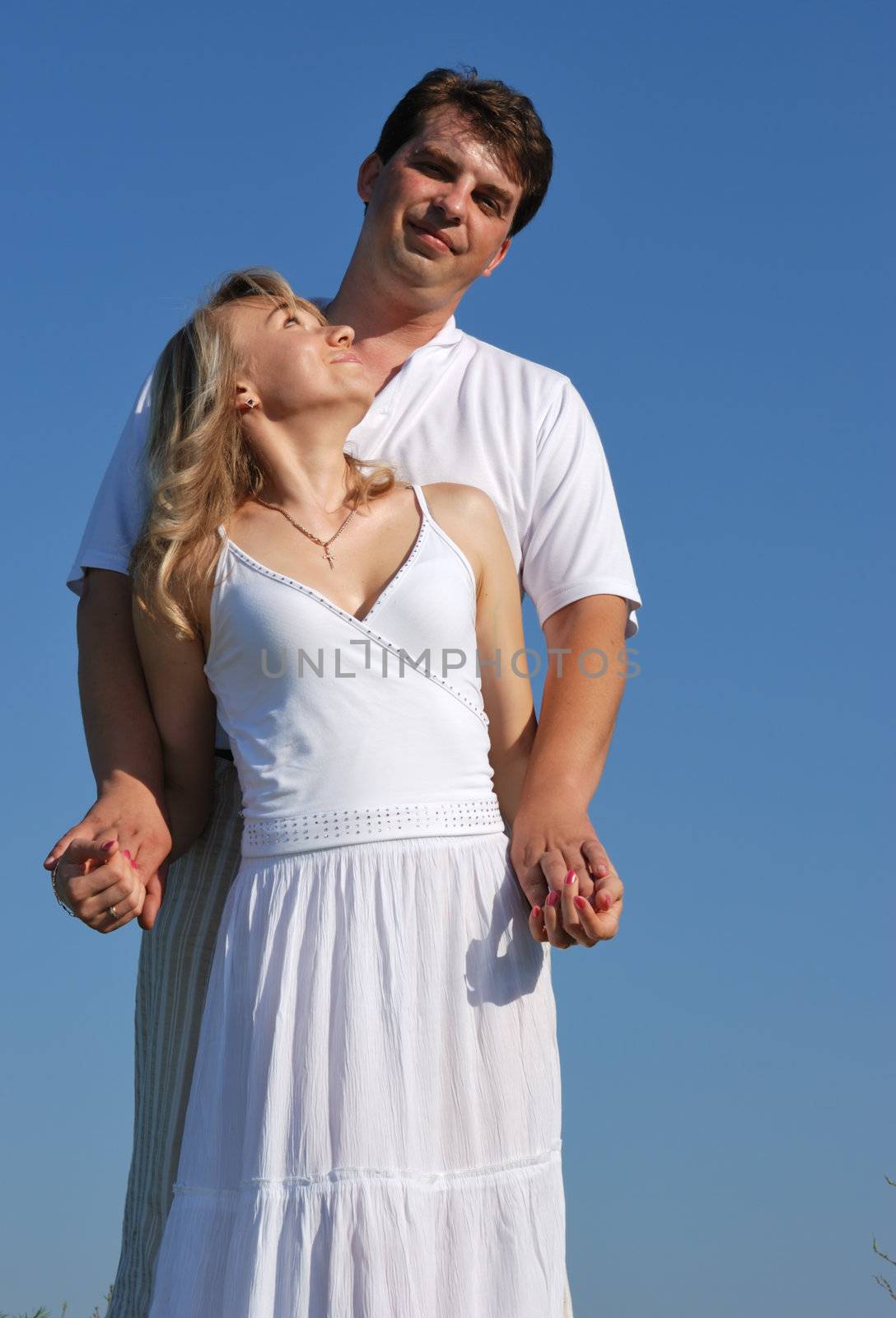 Pair enamoured. Happy family on a background of the blue sky