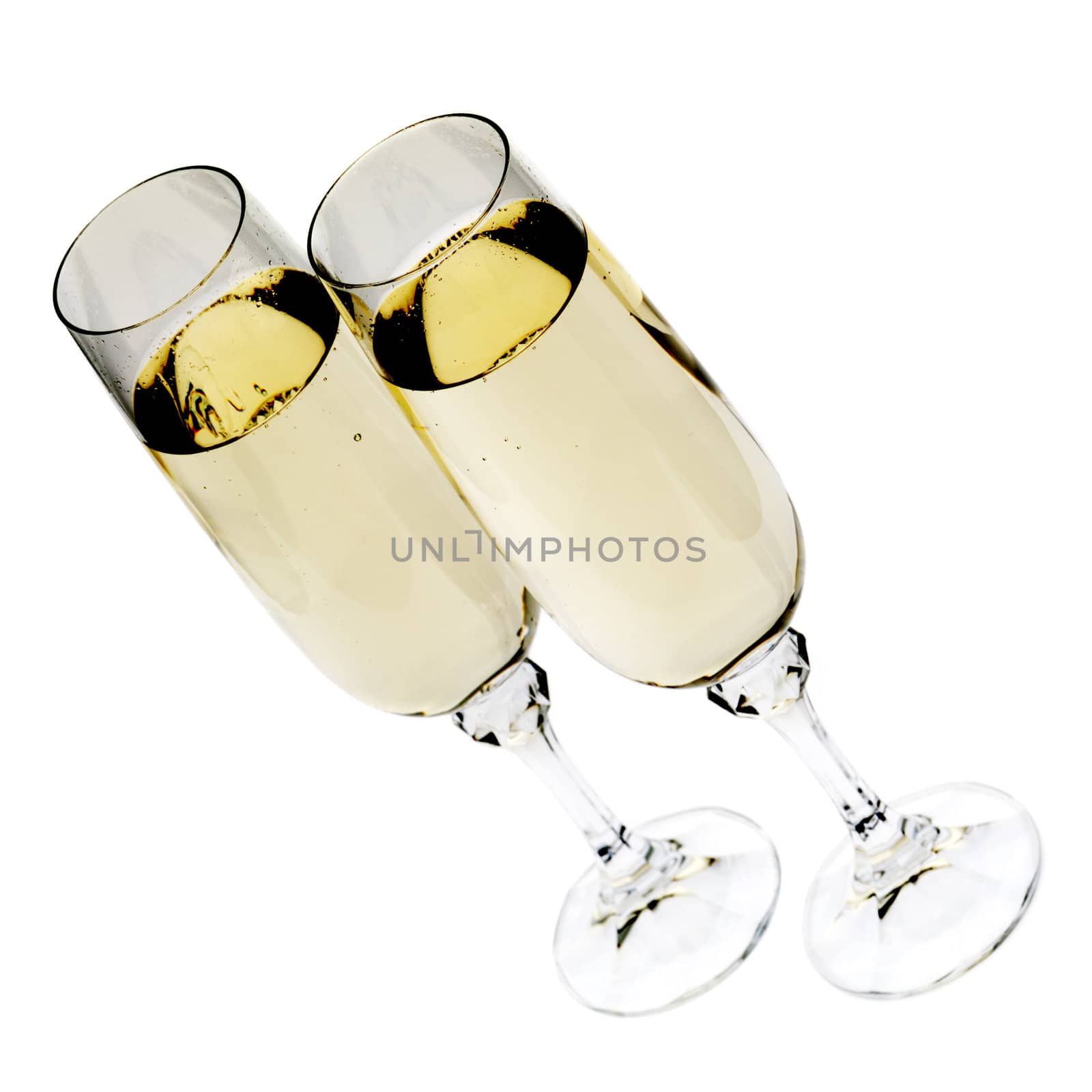 Wine glass with a champagne. A photo on a gleam, it is isolated on a white background