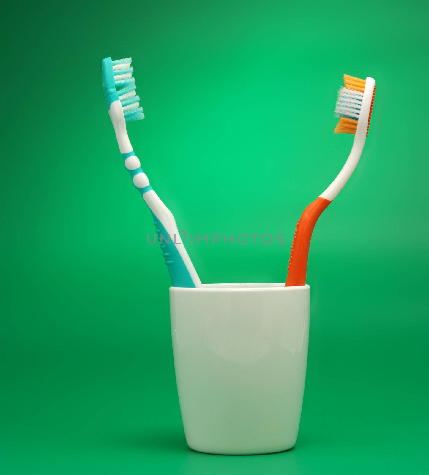Tooth-brush green background by galdzer