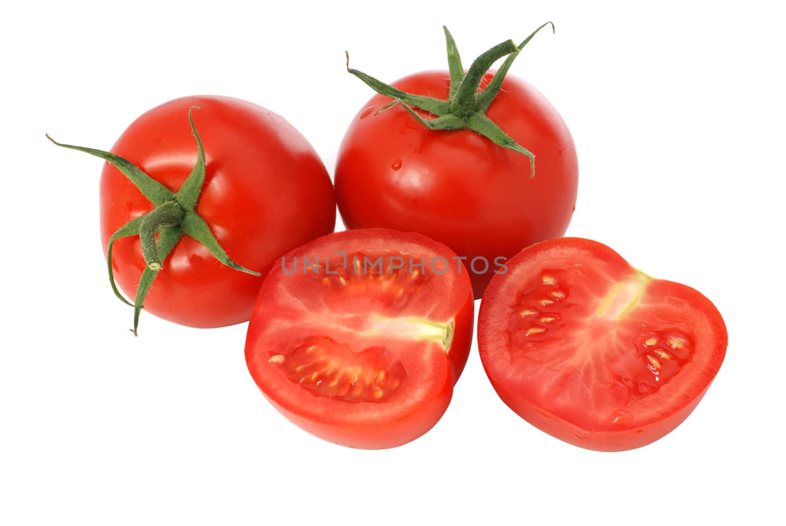 cut tomato isolated. It is isolated on a white background. A ripe vegetable.