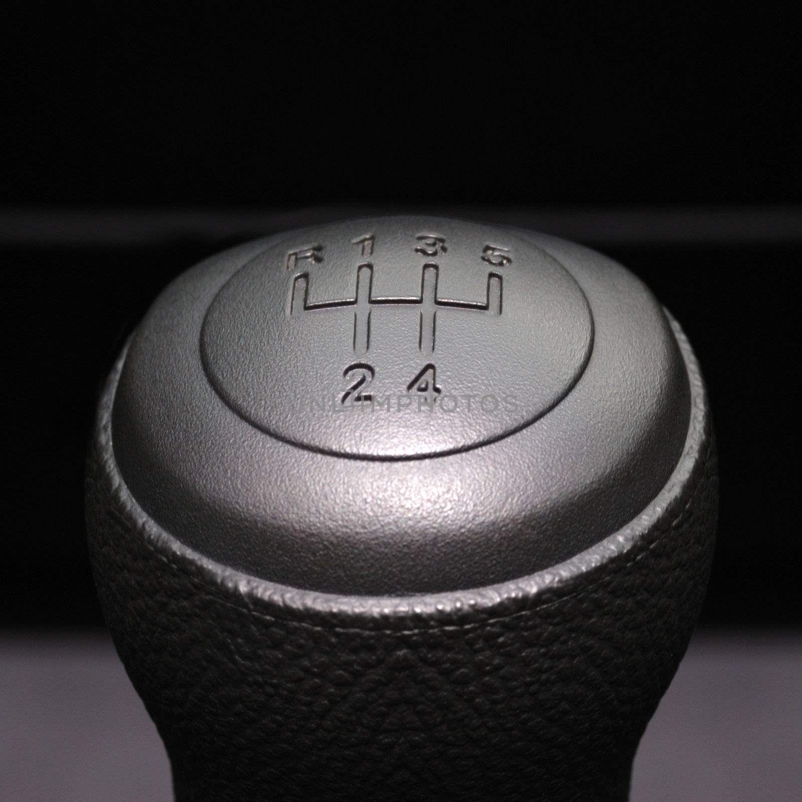The handle of switching of transfers in the car. The leather handle of a box of transfers