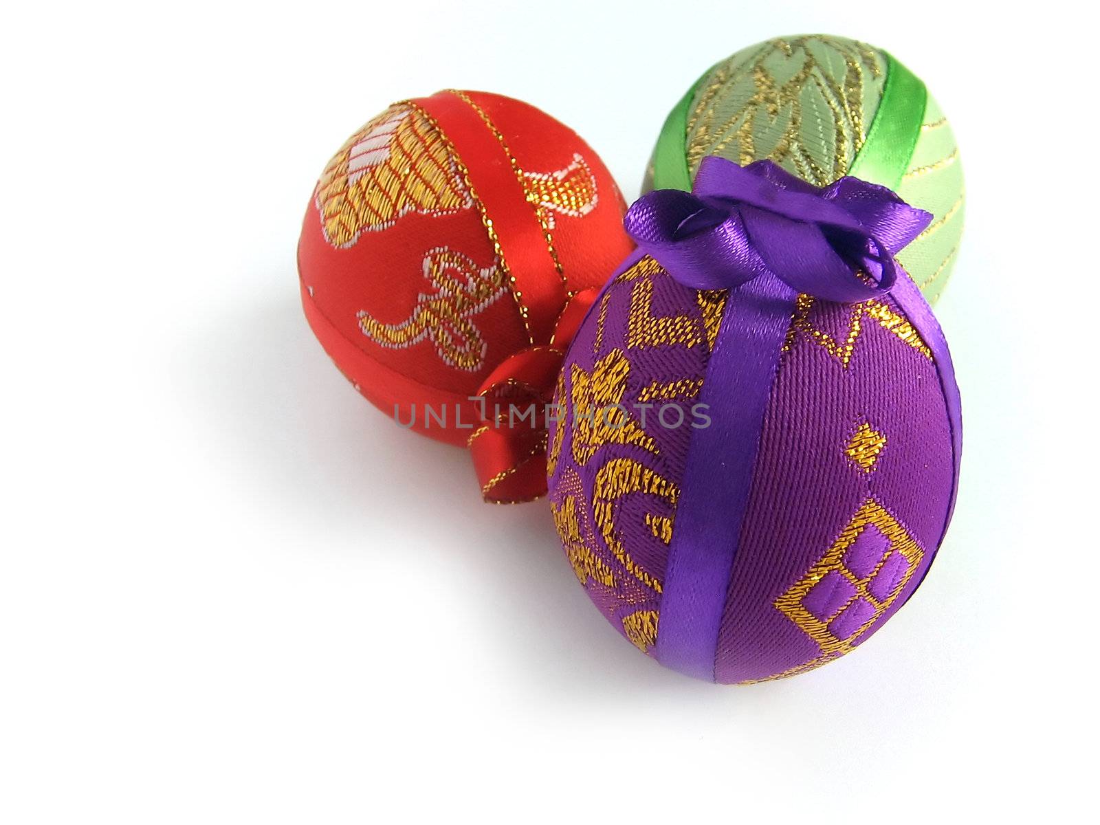 Easter eggs tied up by tapes - a surprise (handmade) - isolated white background