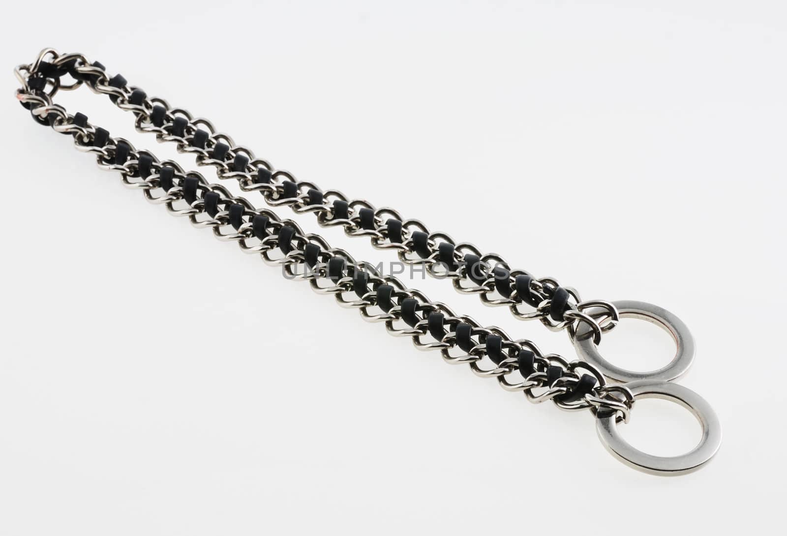 chain with ring and  the inserted leather thong. It is isolated on a white background