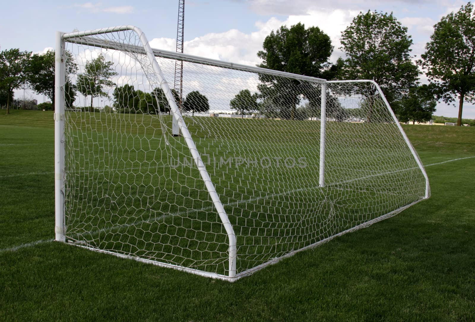 A view from behind the net on a soccer pitch.