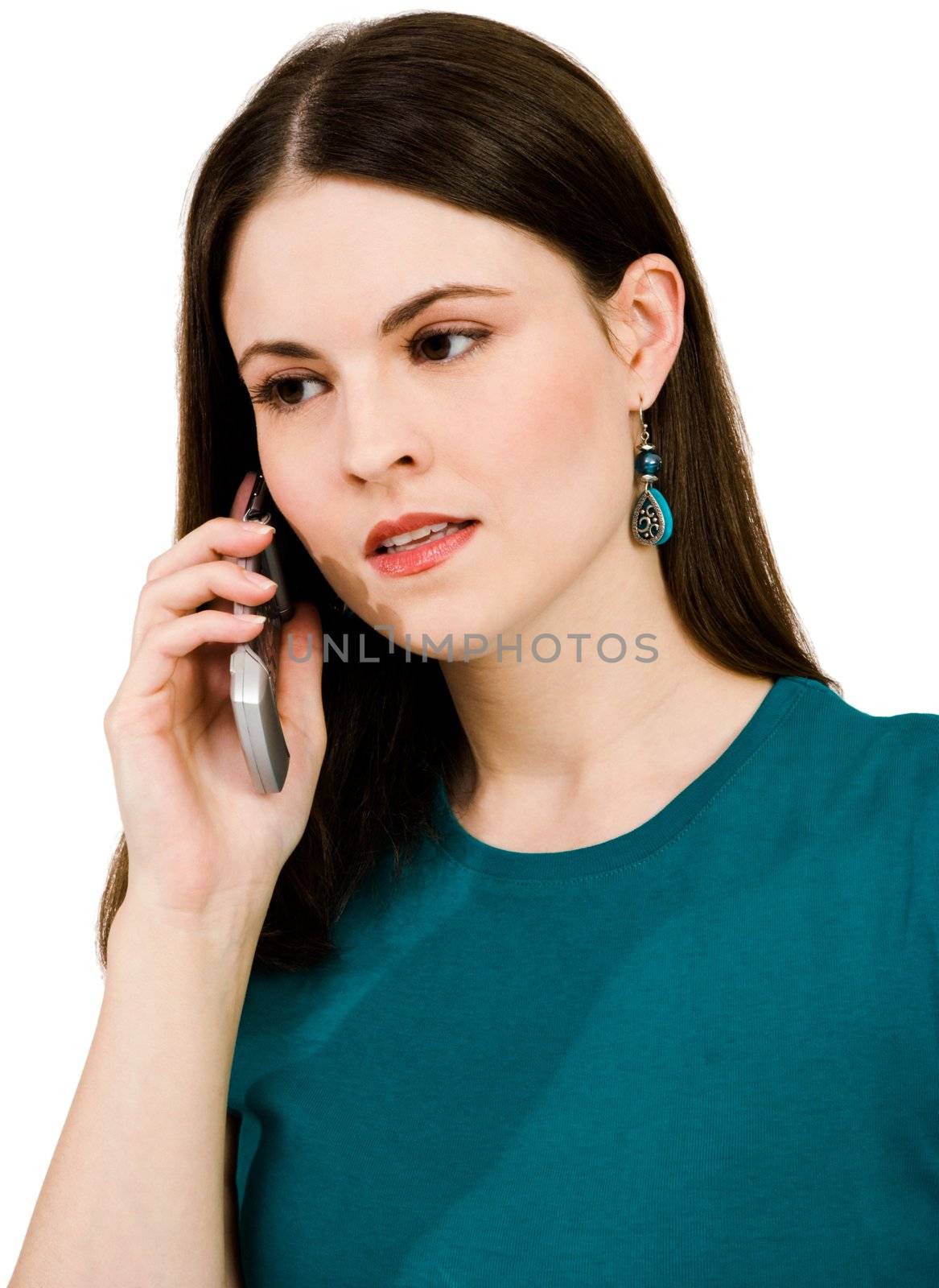 Beautiful woman talking on a mobile phone isolated over white