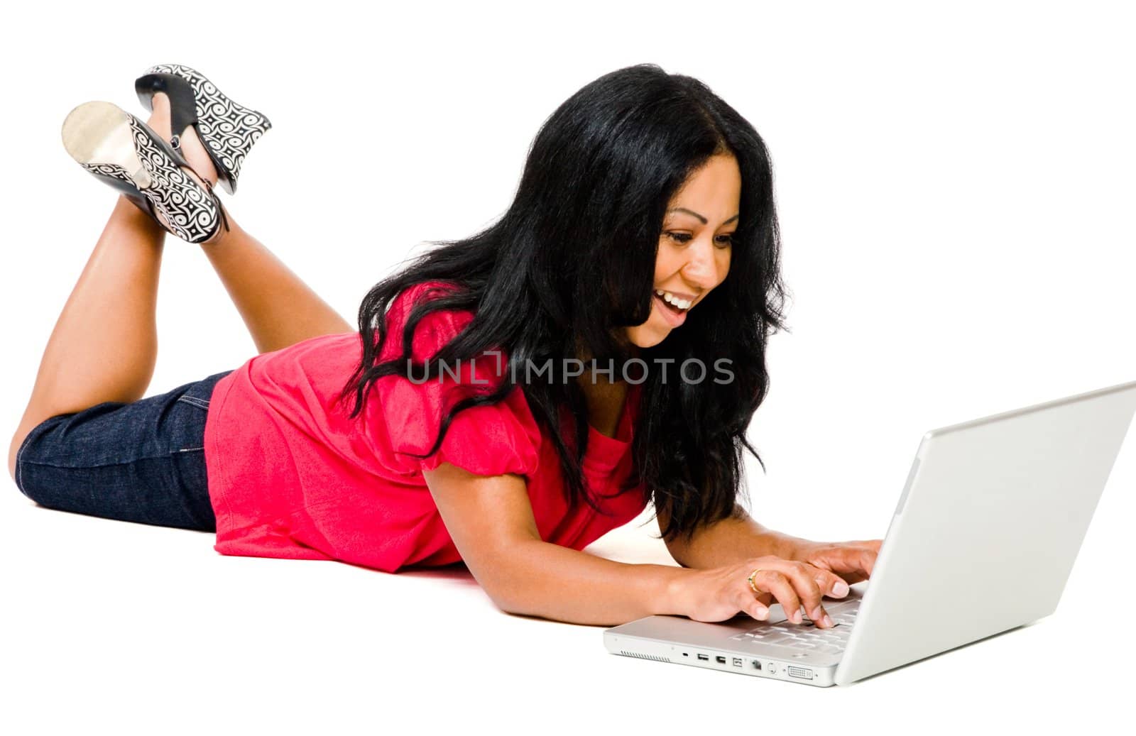Mid adult woman using a laptop  by jackmicro