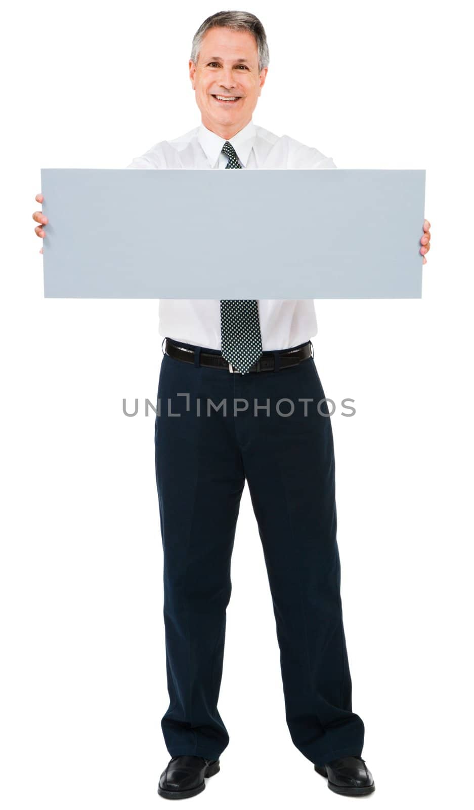 Smiling businessman holding a placard isolated over white
