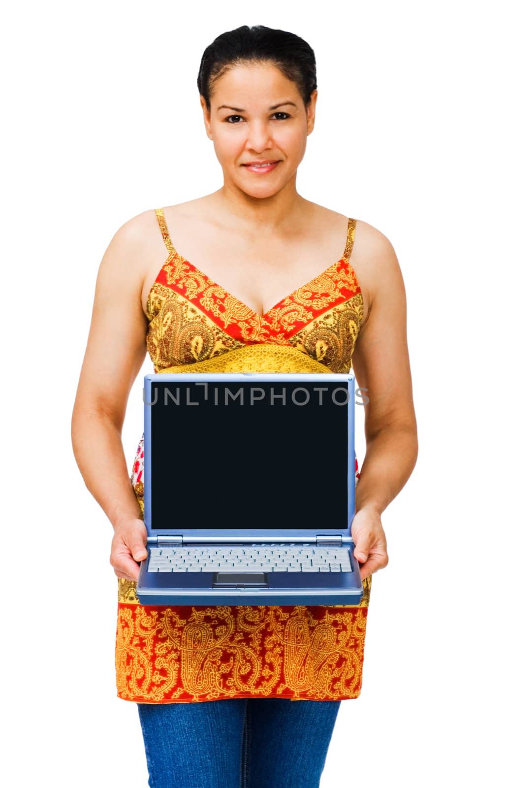 Mixed race woman holding a laptop and smiling isolated over white