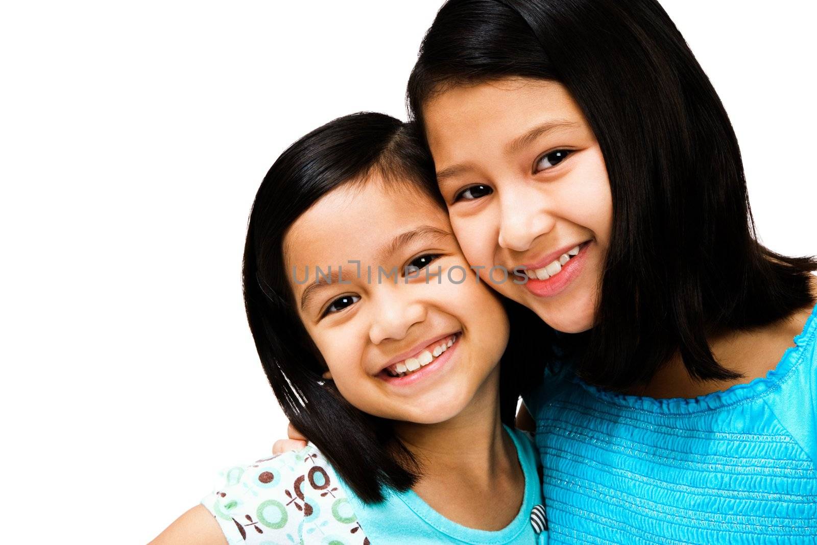 Smiling girls posing together isolated over white