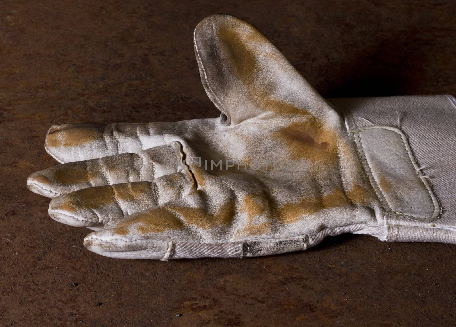used working glove with brown background