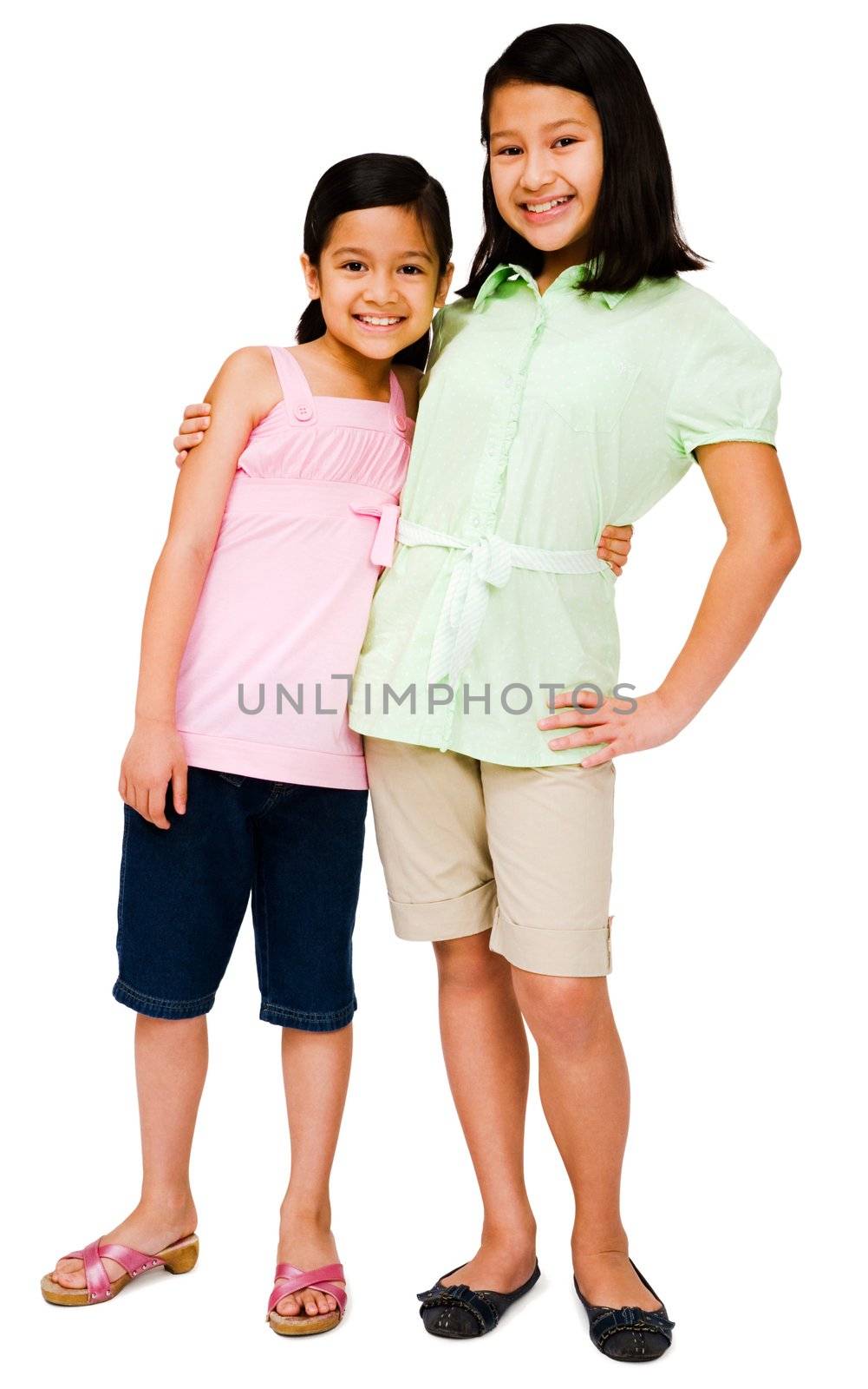 Two girls posing and smiling together isolated over white
