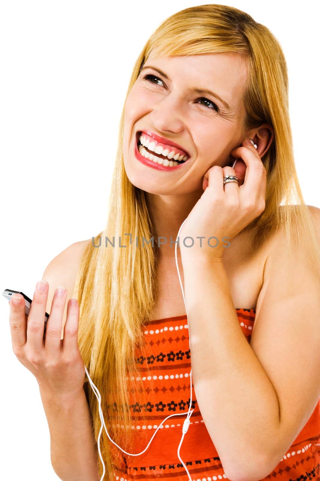 Cheerful woman listening to music on MP3 player isolated over white