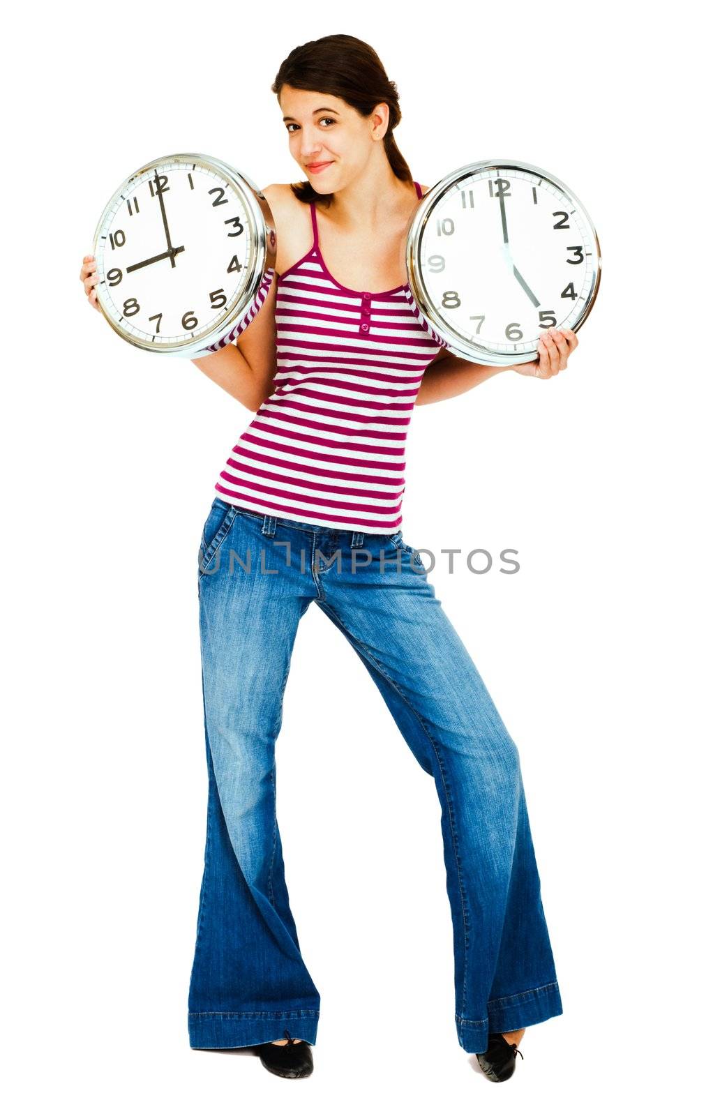 Close-up of a woman holding clocks and smiling isolated over white