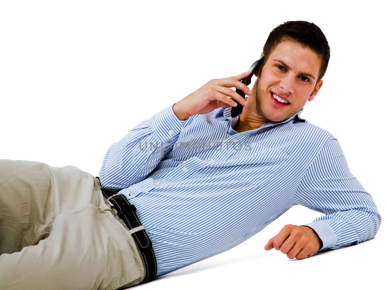 Smiling man talking on a mobile phone isolated over white