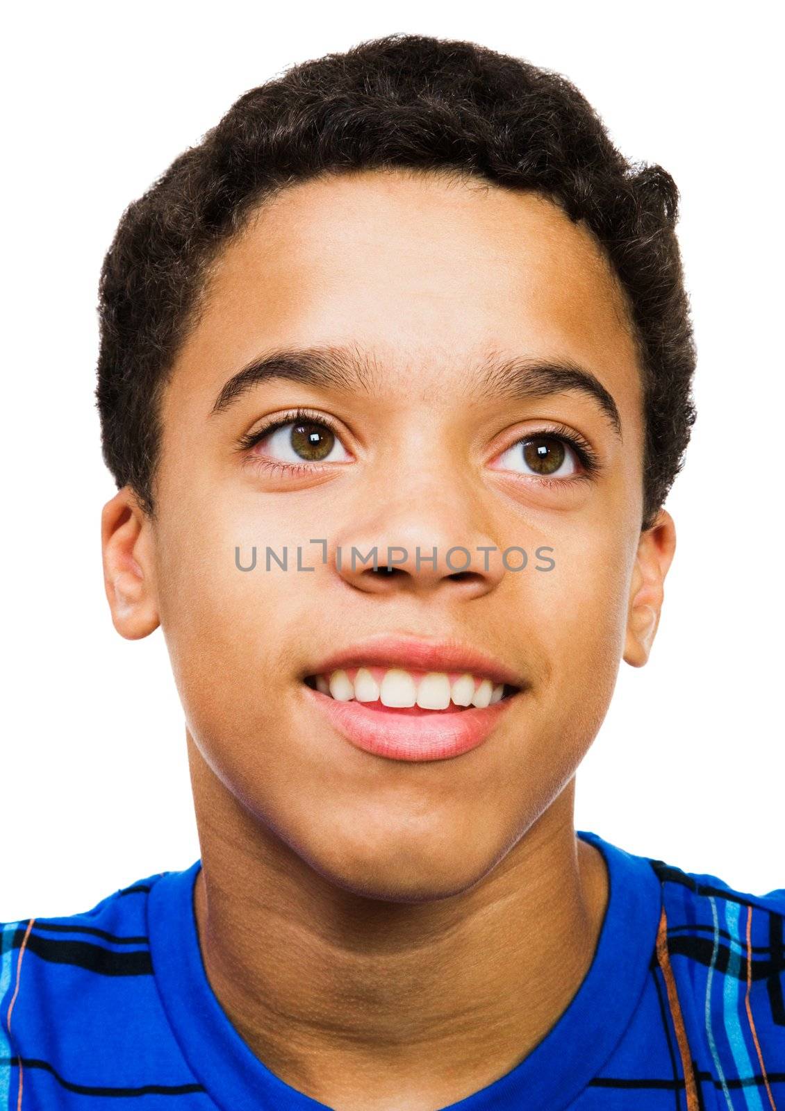 Teenage boy smiling isolated over white