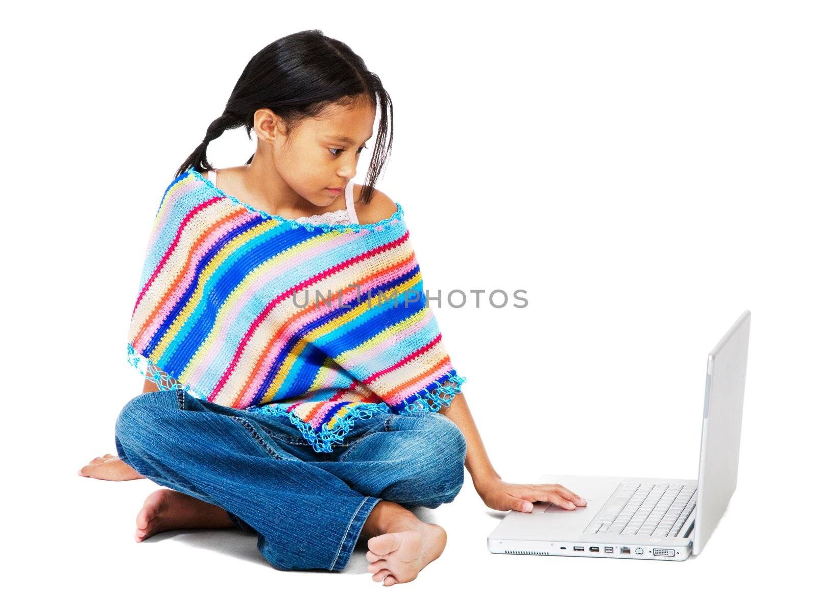 Girl working on a laptop isolated over white