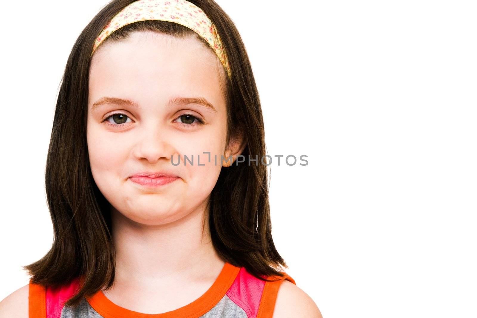 Portrait of a Caucasian girl smirking isolated over white