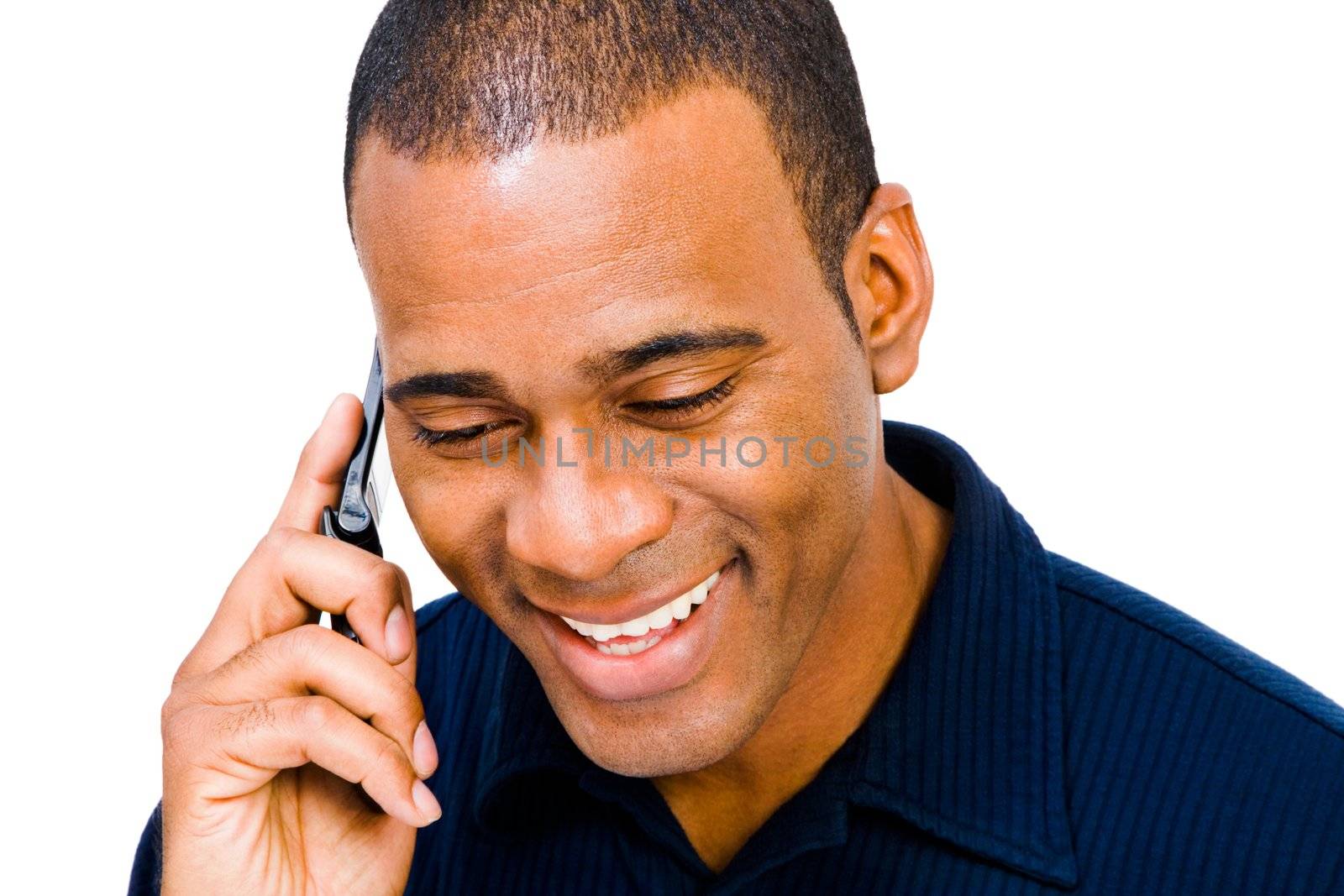 Handsome man talking on a mobile phone isolated over white