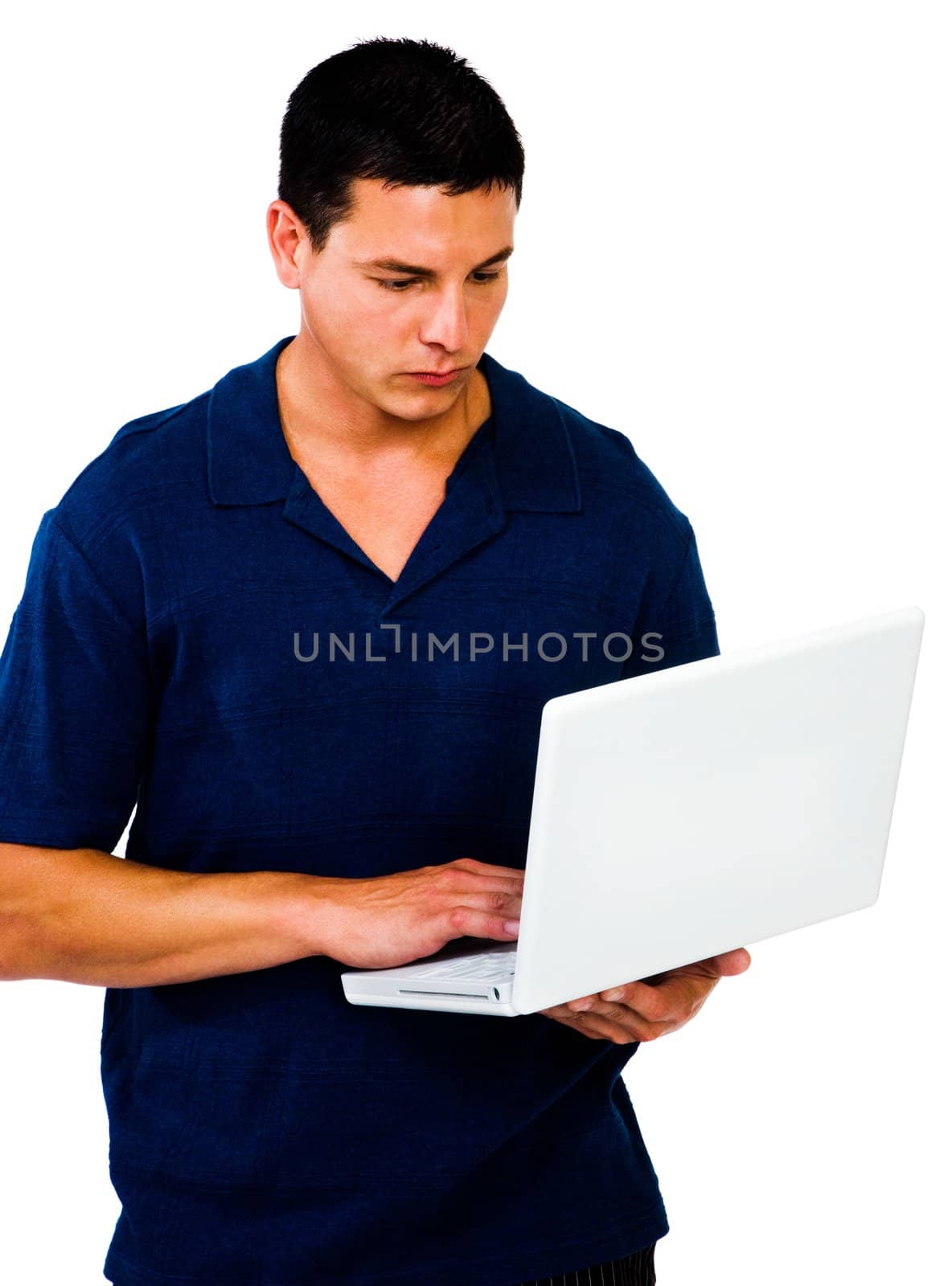 Caucasian man using a laptop and posing isolated over white